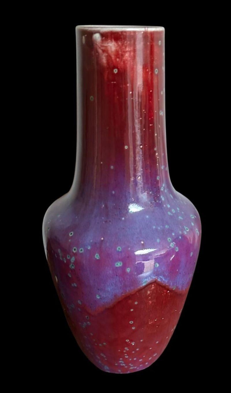 5365
Large Ruskin High-Fired vase of shouldered form with a good curtained and speckled glaze
A contained area with glaze losses from the time of manufacture
Dated 1932
Measures: 38cm high, 17cm wide.