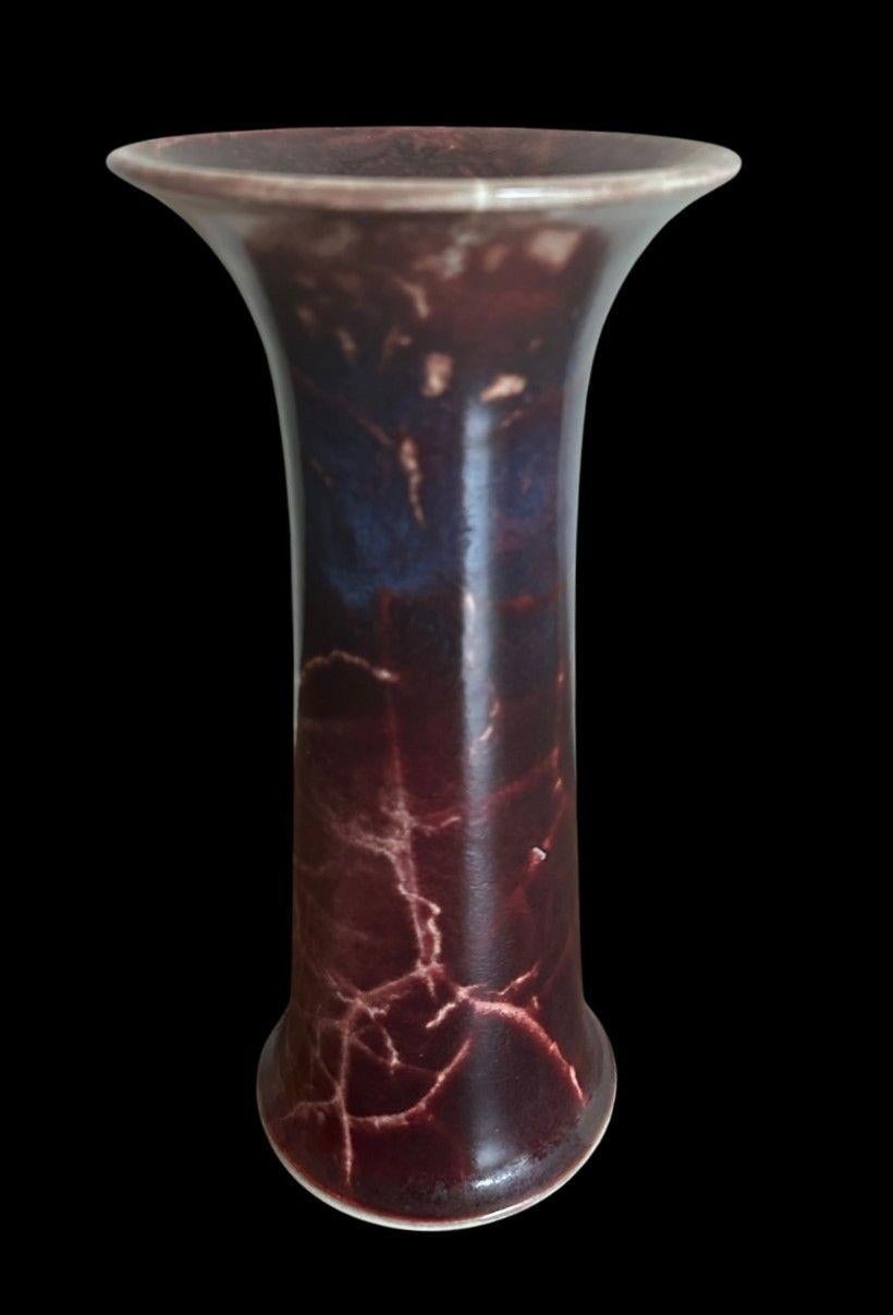 5384
Ruskin Lily Vase decorated with a Sang de Beouf High-fired glaze porously decorated with Fissures.
24.5cm high, 12 cm high
Dated 1910.