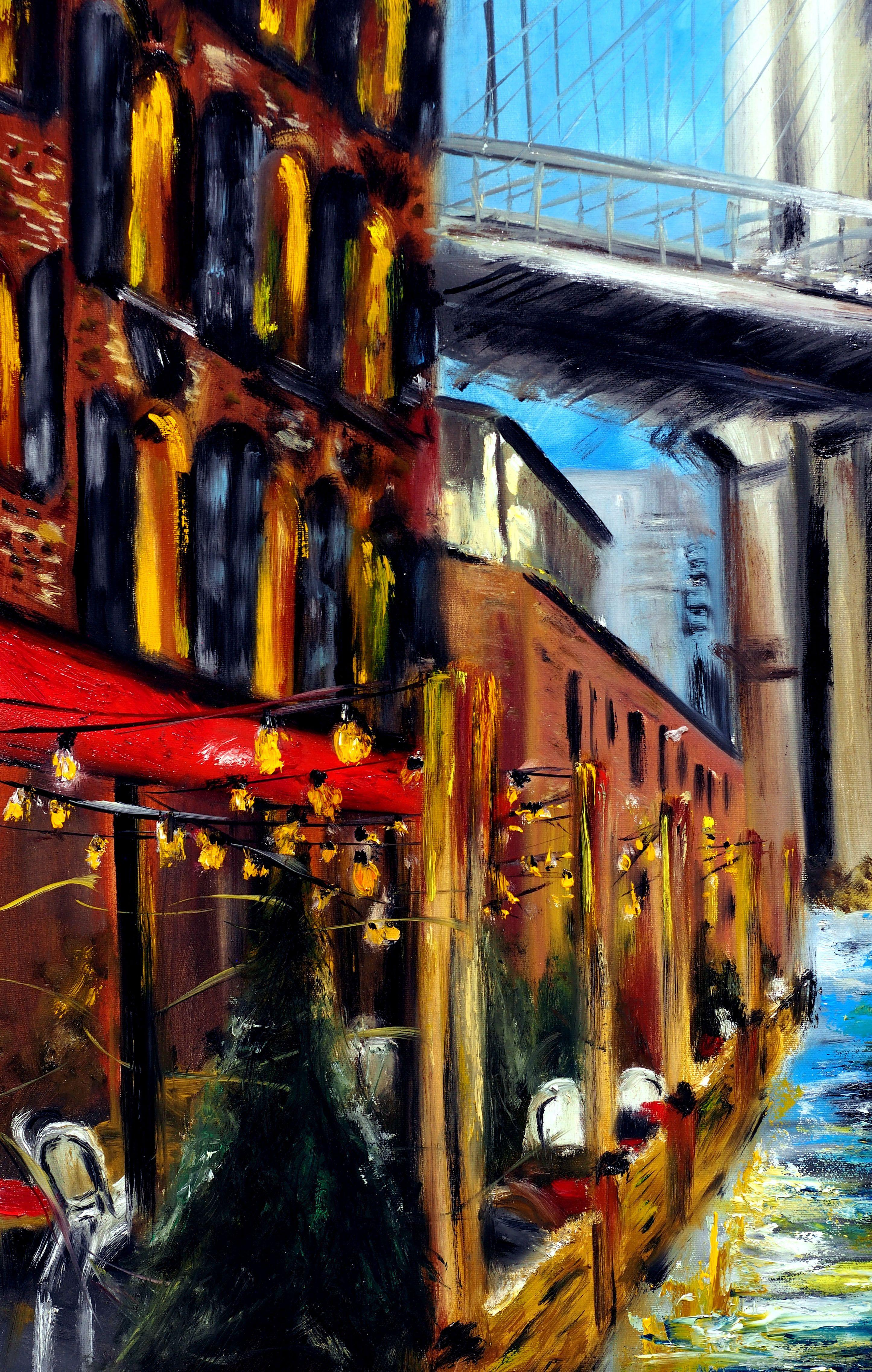 Questo quadro originale, unico nel suo genere, raffigura il noto quartiere di DUMBO a New York. L'autunno illumina la scena con foglie dorate mentre guardiamo il ponte di Brooklyn in lontananza. L'artista utilizza la tecnica speciale della spatola
