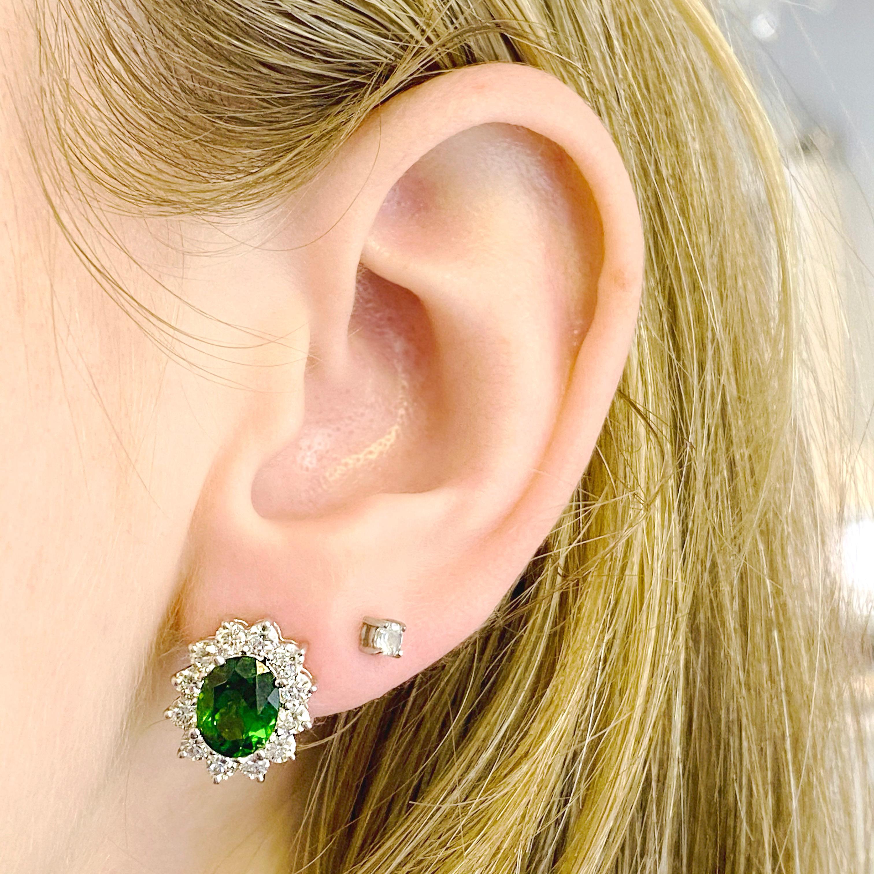 These pristine earrings have amazing quality.  The Russalite is a rich green color and the diamonds going around the cushion shaped stone is perfect. Russalite is a natural genuine gemstone that is mined in Siberia.  It has not be treated and is a