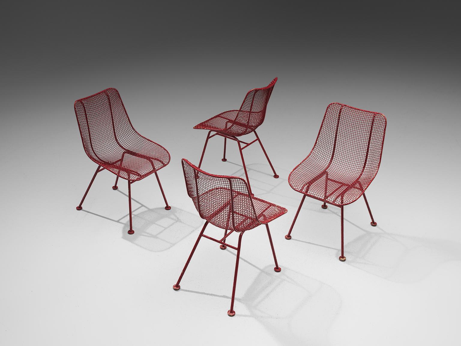 Russell Woodard 'Sculptura' patio chairs in wrought iron and red lacquer, United States, 1950s. 

These 'Sculptura' patio chairs, which can be used as dining chairs as well, are in iron and woven steel. The intertwined steel creates a mesh and
