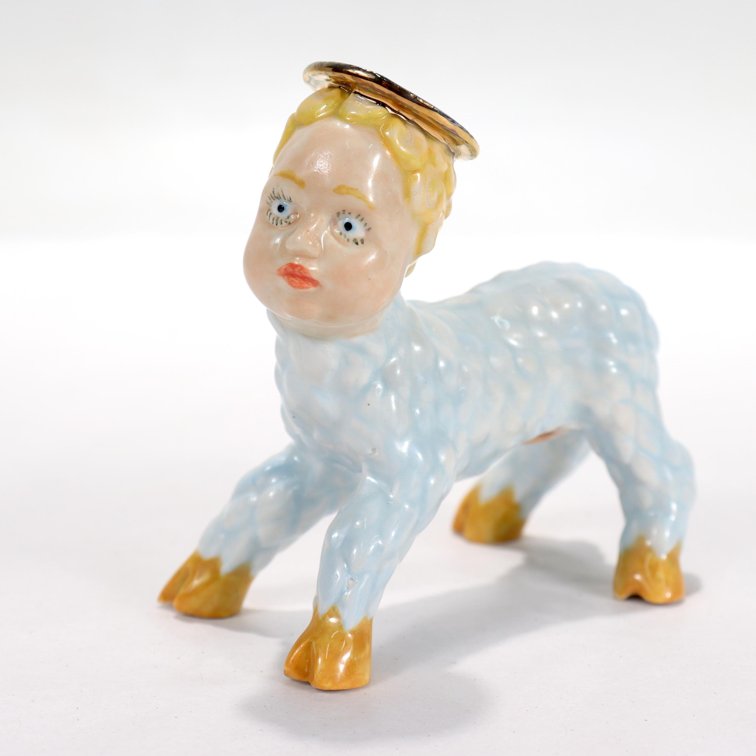 A fine porcelain figurine.

From the 'Mary Had a Little Lamb' series.

In the form of a lamb with a human head and halo.

By Russel Biles. 

A self-described “son of the South,” Russell Biles was born, raised, and still lives in the southern