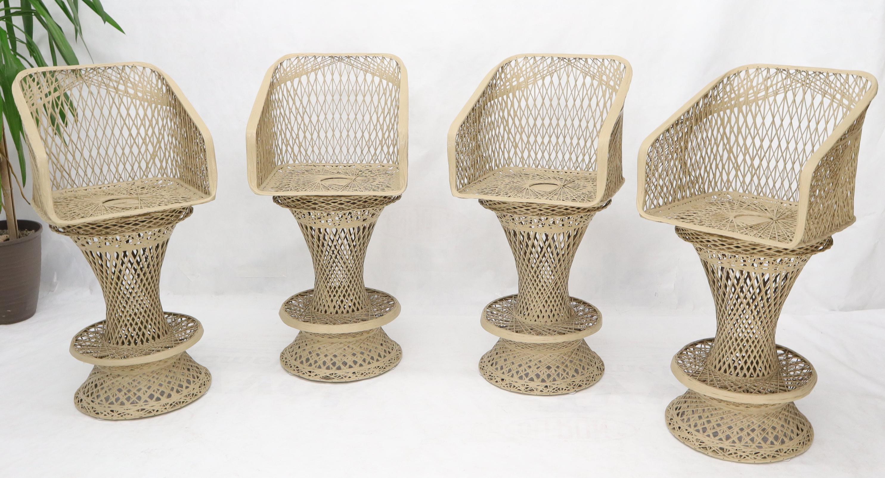 Mid-Century Modern set of four Russel Woodard bar stools.