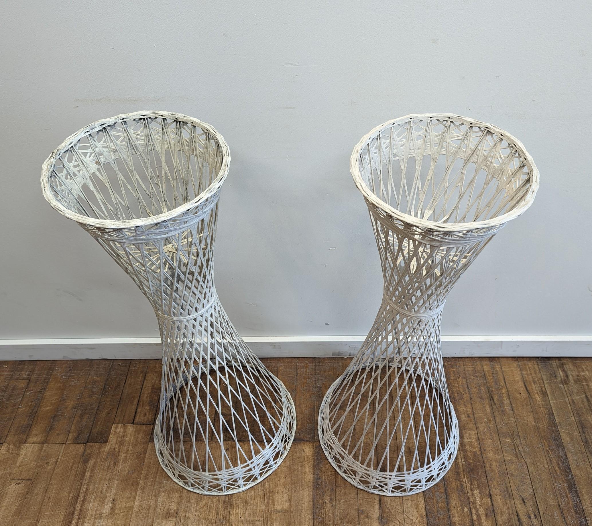 Pair of Russell Woodard Spun Fiberglass Plant Stands Mid Century Modern.  
Nice pair of plant stands.  Light weight can be used inside, outside, patio.  in original white paint.  Very good condition.  Can easily be painted back or any color for