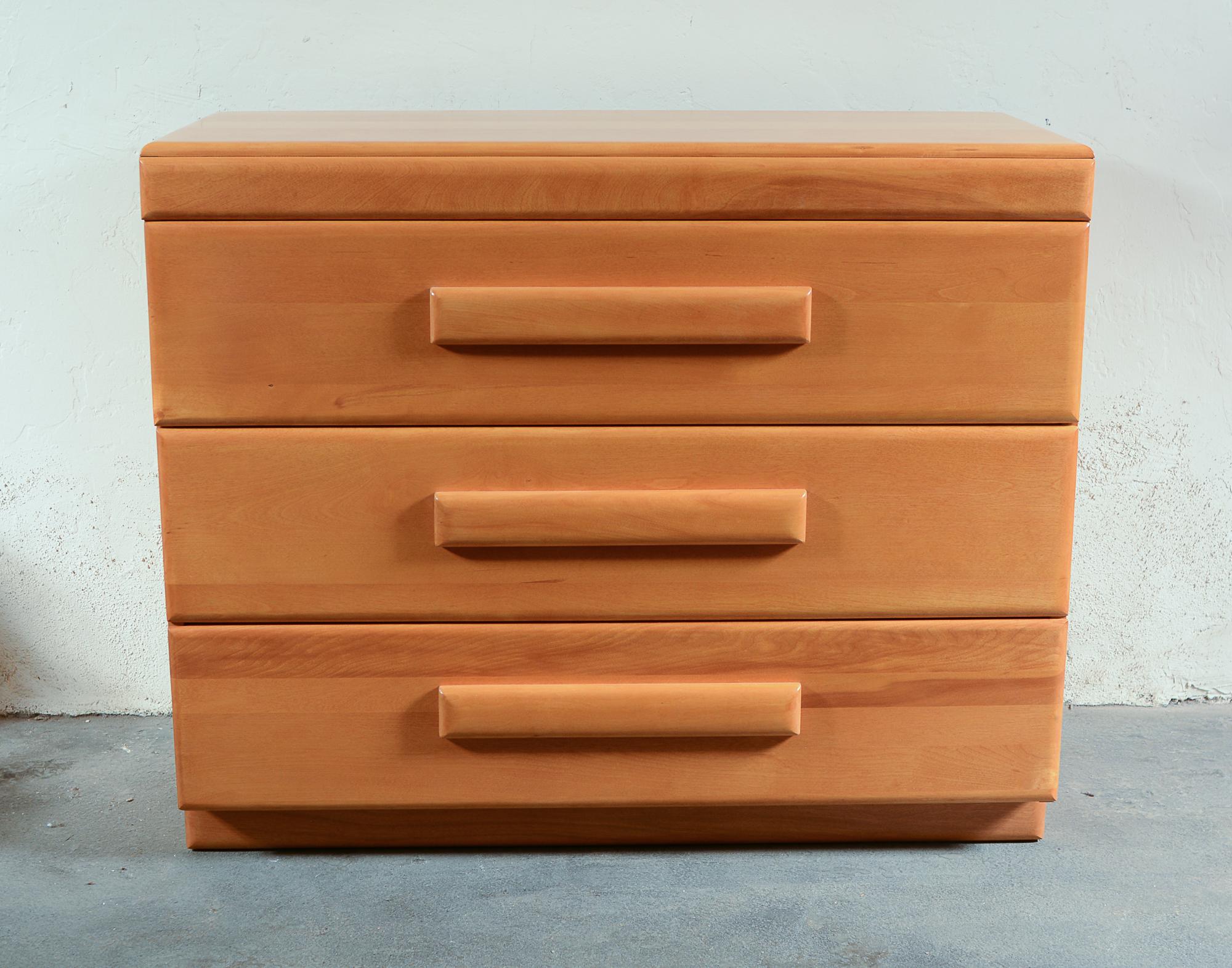 Three drawer dresser designed by Russel Wright. This was part of the American Modern line he designed in 1935 for Conant Ball. The dresser is solid maple. The drawers are deep and tall and hold a lot of clothing. This has been refinished.