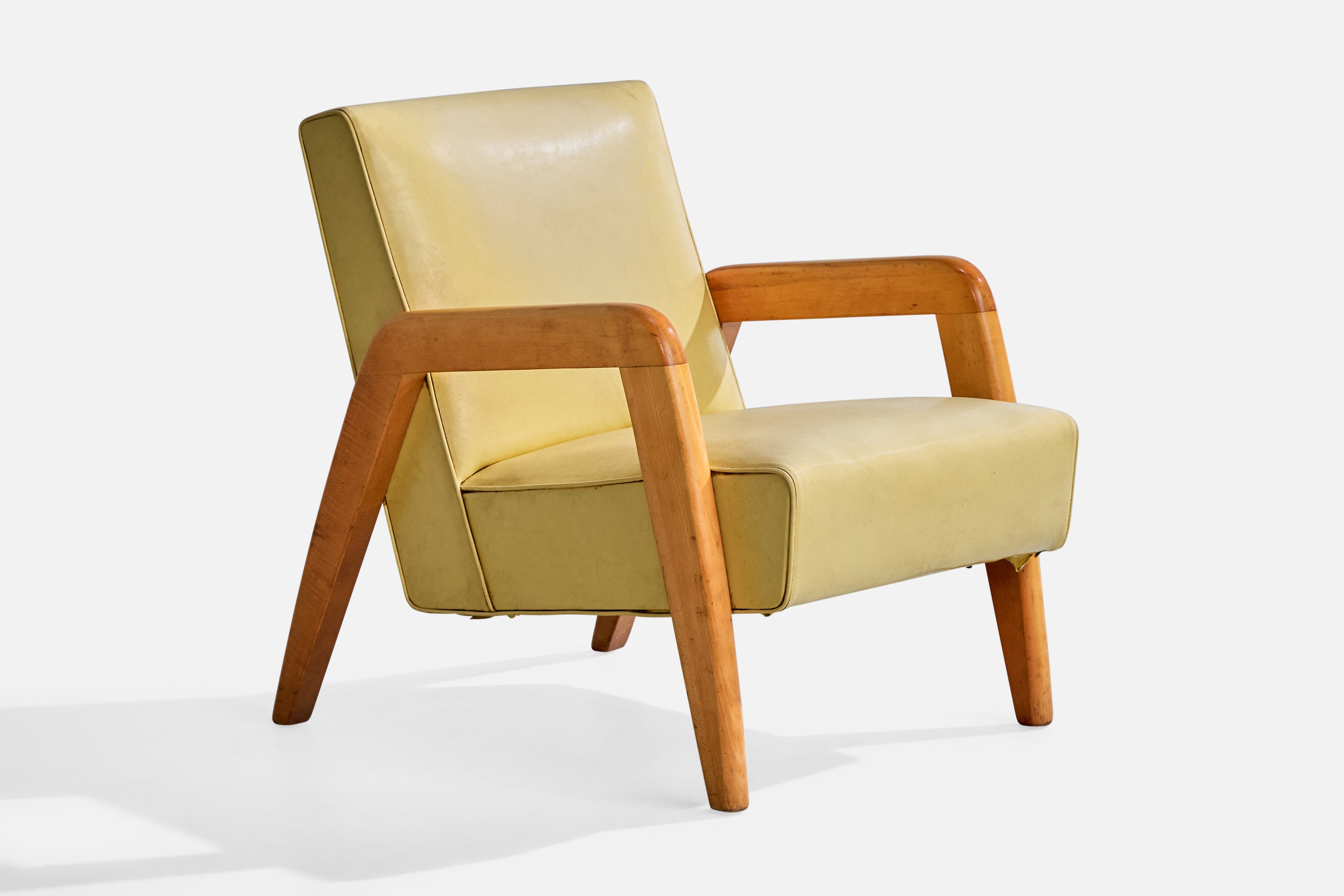 A wood and yellow vinyl lounge chairs attributed to Russel Wright, USA, c. 1940s.

Vintage vinyl in fair condition

Wear consistent with age and use

Overall Dimensions (inches): 30.5