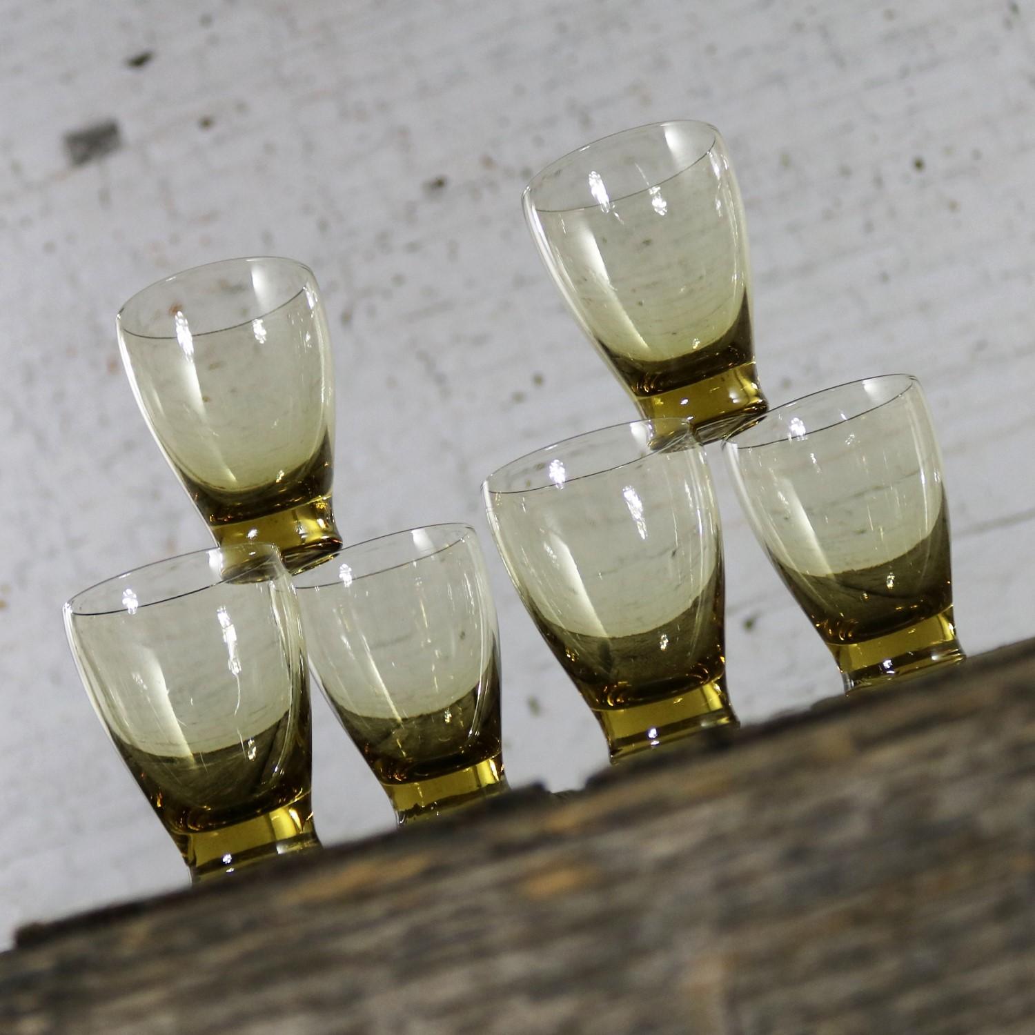 Awesome set of six Russel Wright chartreuse, but they look yellow or amber, Morgantown American Modern juice glasses. They are in excellent vintage condition with no chips cracks or chiggers, circa 1950s.

I really admire the gently curving shape