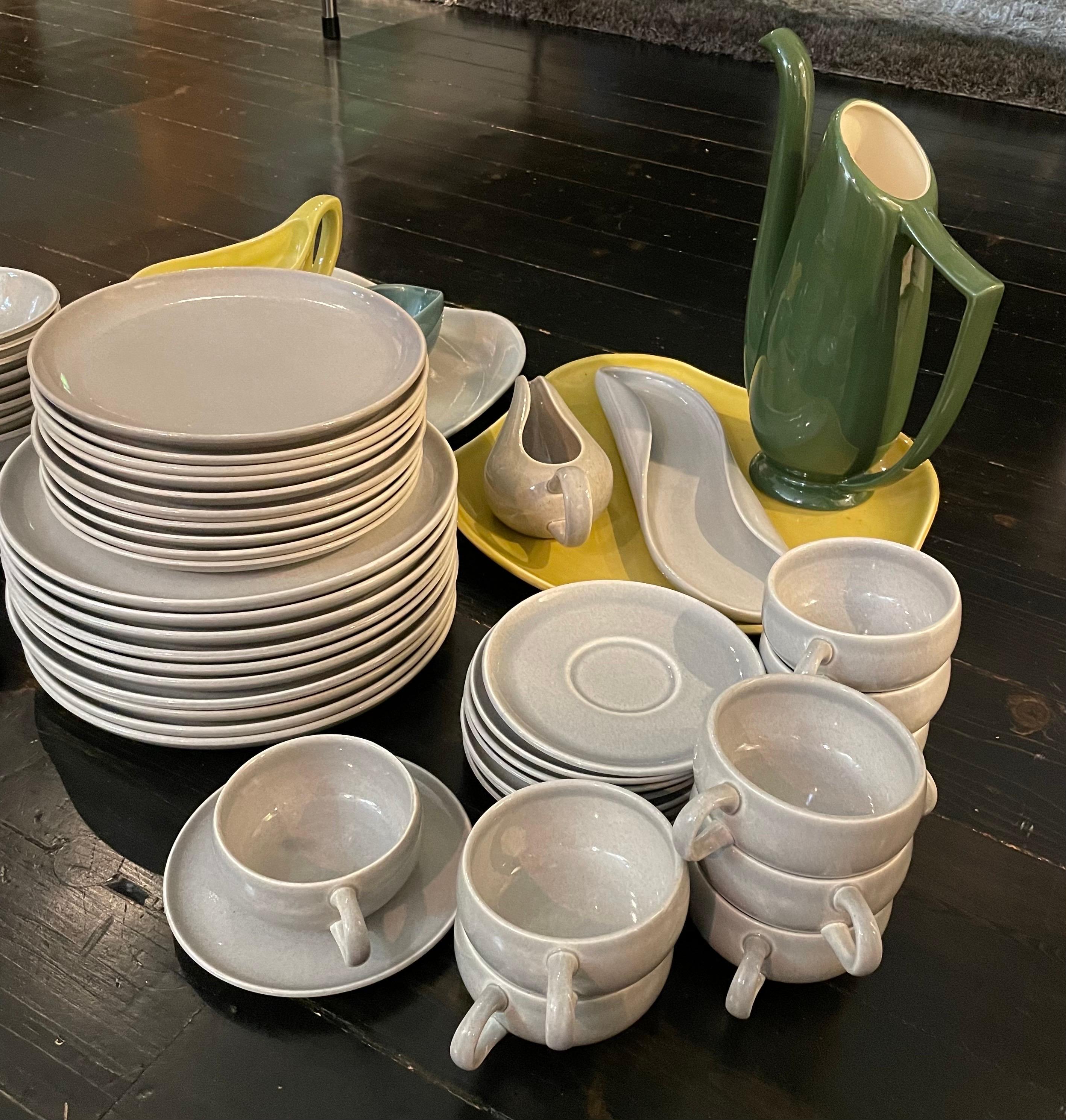60 pieces in total of Russel Wright for Steubenville ceramic dinnerware.  Pitcher and one grave boat un-hallmarked, other gravy boat is by Bauer.