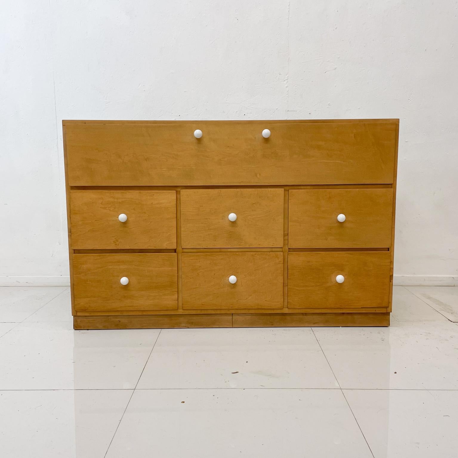 Conant Ball dresser cabinet solid maple wood with fancy white pull knobs multi drawer dresser cabinet with double dove tail joinery.
Maker Stamp CB present. Estimated early 1900s. Gardner, MA
Dimensions: 49.75 W x 19 D x 32.38 H