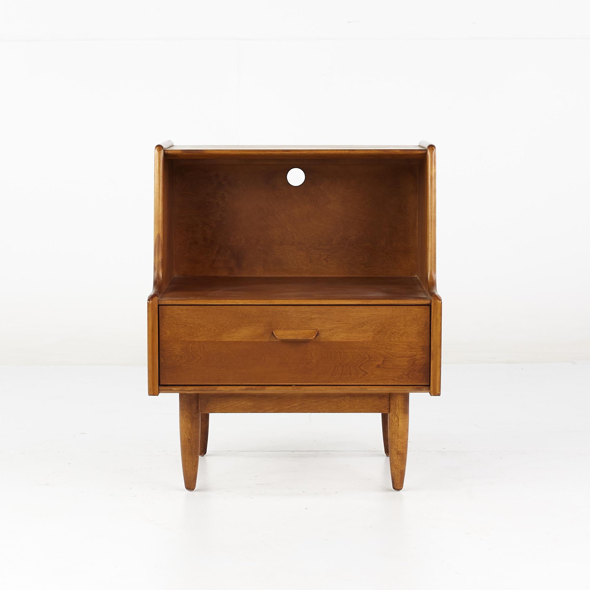Russel Wright for Conant Ball Mid Century Maple nightstand

This nightstand measures: 22 wide x 19 deep x 25 inches high

All pieces of furniture can be had in what we call restored vintage condition. That means the piece is restored upon