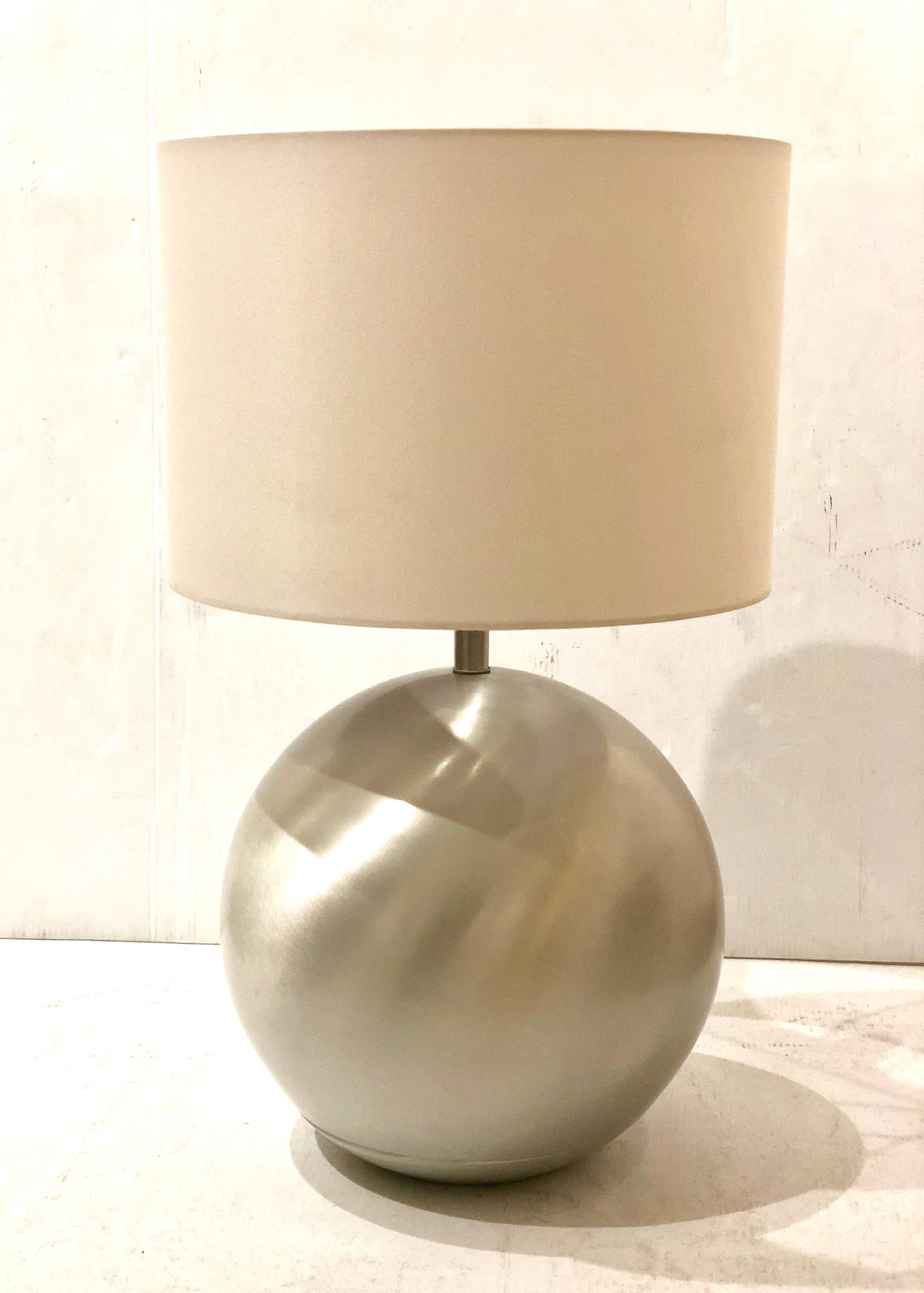 A very nice looking and rare Russel Wright for Raymor spun aluminum table lamp, circa 1950s. Newly rewired, new socket, cord and plug. New lamp shade, the shade its 17