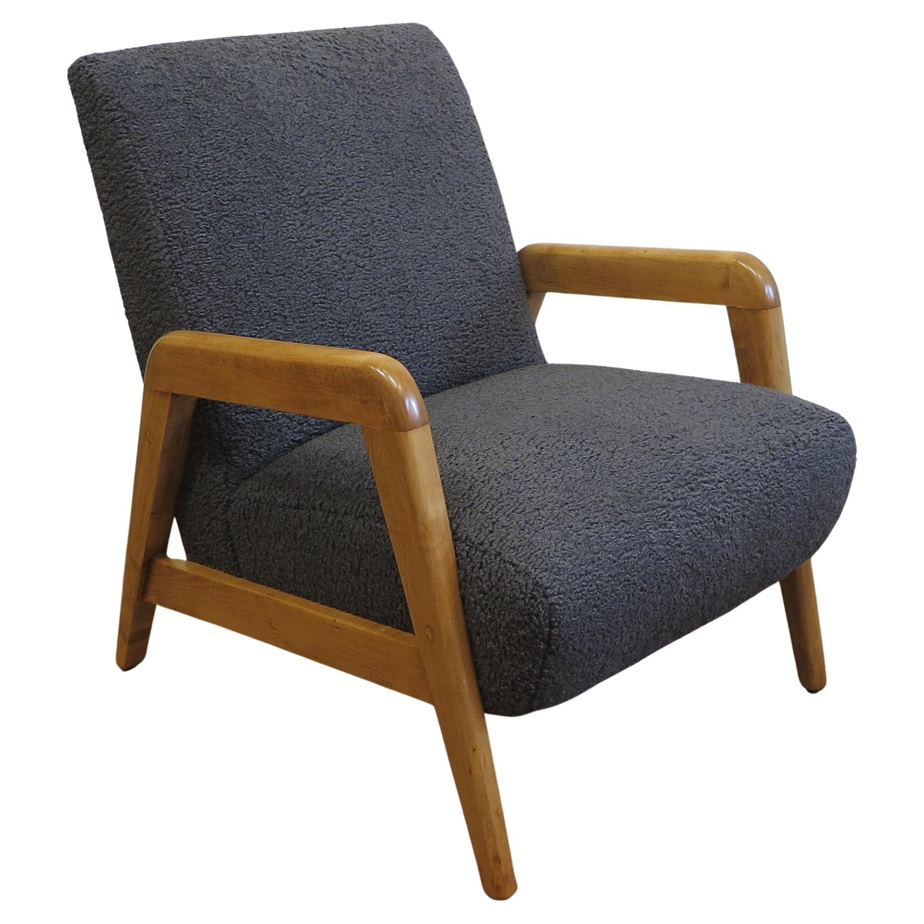 Russel Wright lounge chair for Thonet. Iconic American mid century lounge Chair designed by Russel Wright produced by Thonet. Solid maple wood frame legs, well built spring bound wooden carriage body with foam cushioning and faux shearling fabric,