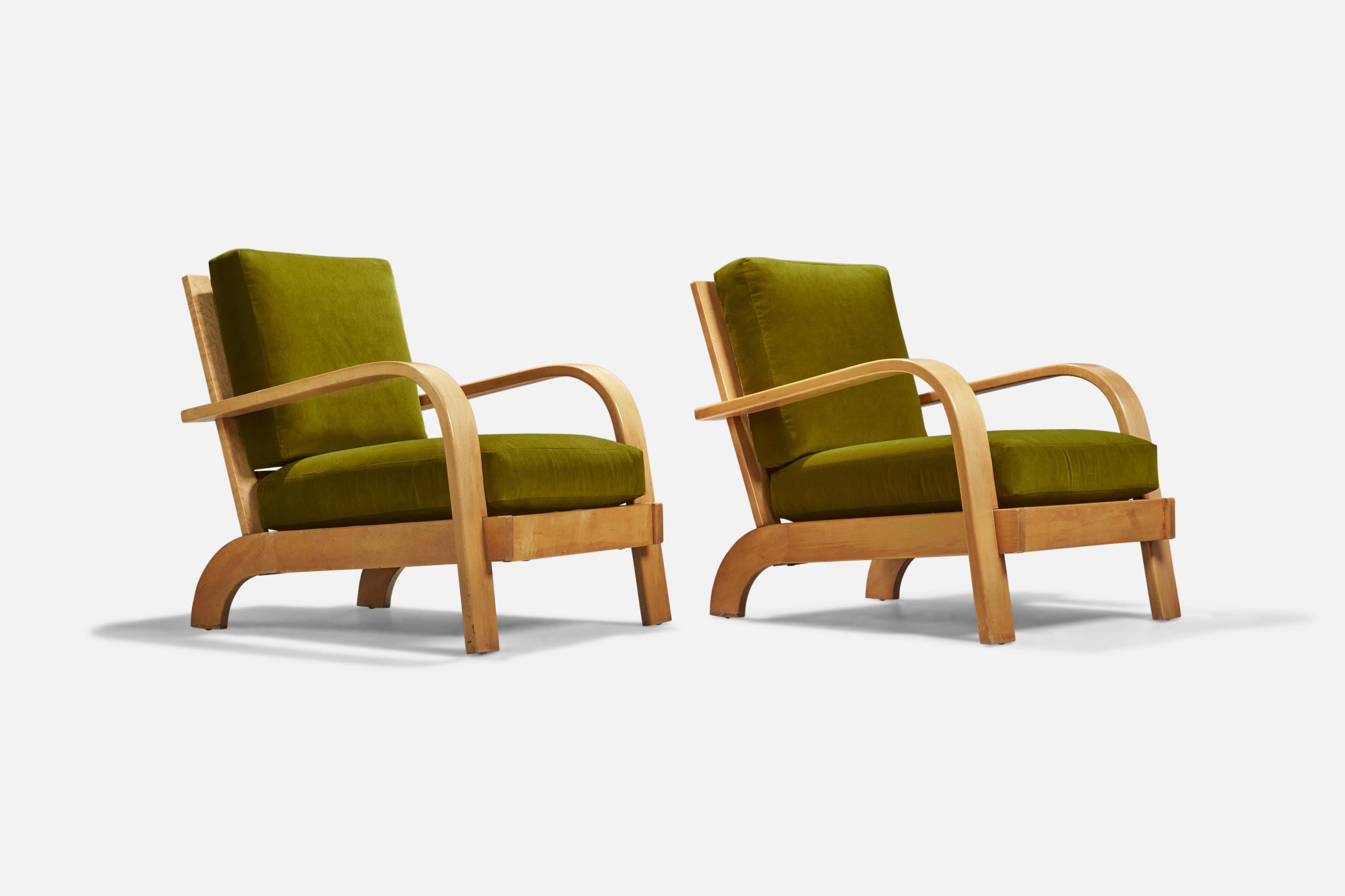 A pair of green velvet and maple lounge chairs designed by Russel Wright for Conant Ball, USA, c. 1936.