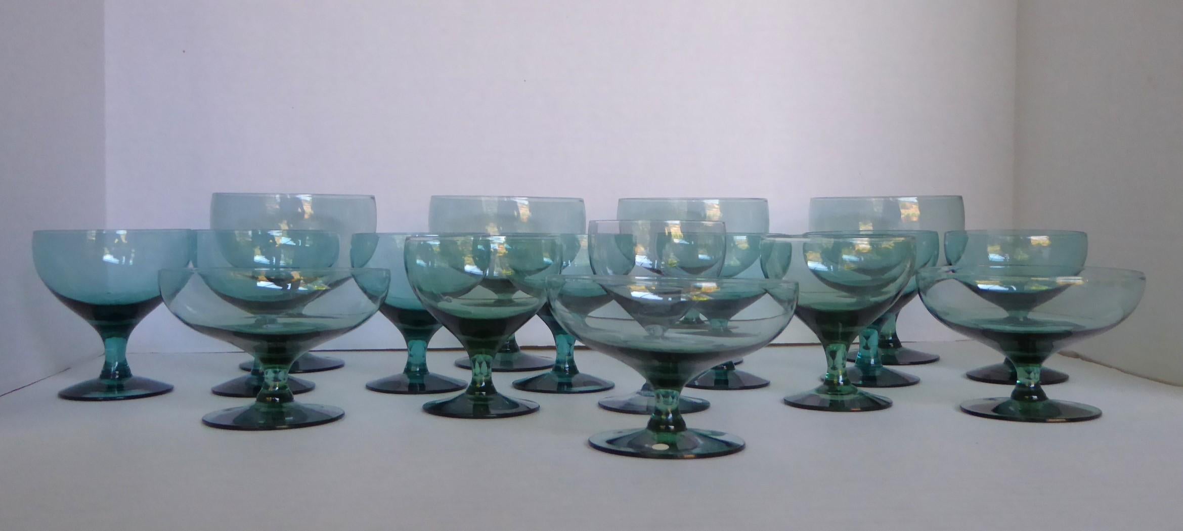 Mid Century grouping of 16 Seafoam American Modern goblets designed by Russel Wright and manufactured by Morgantown. Consisting of Seafoam stem glasses in three different sizes in Very Good condition but one dessert with chip on base  (see pic).