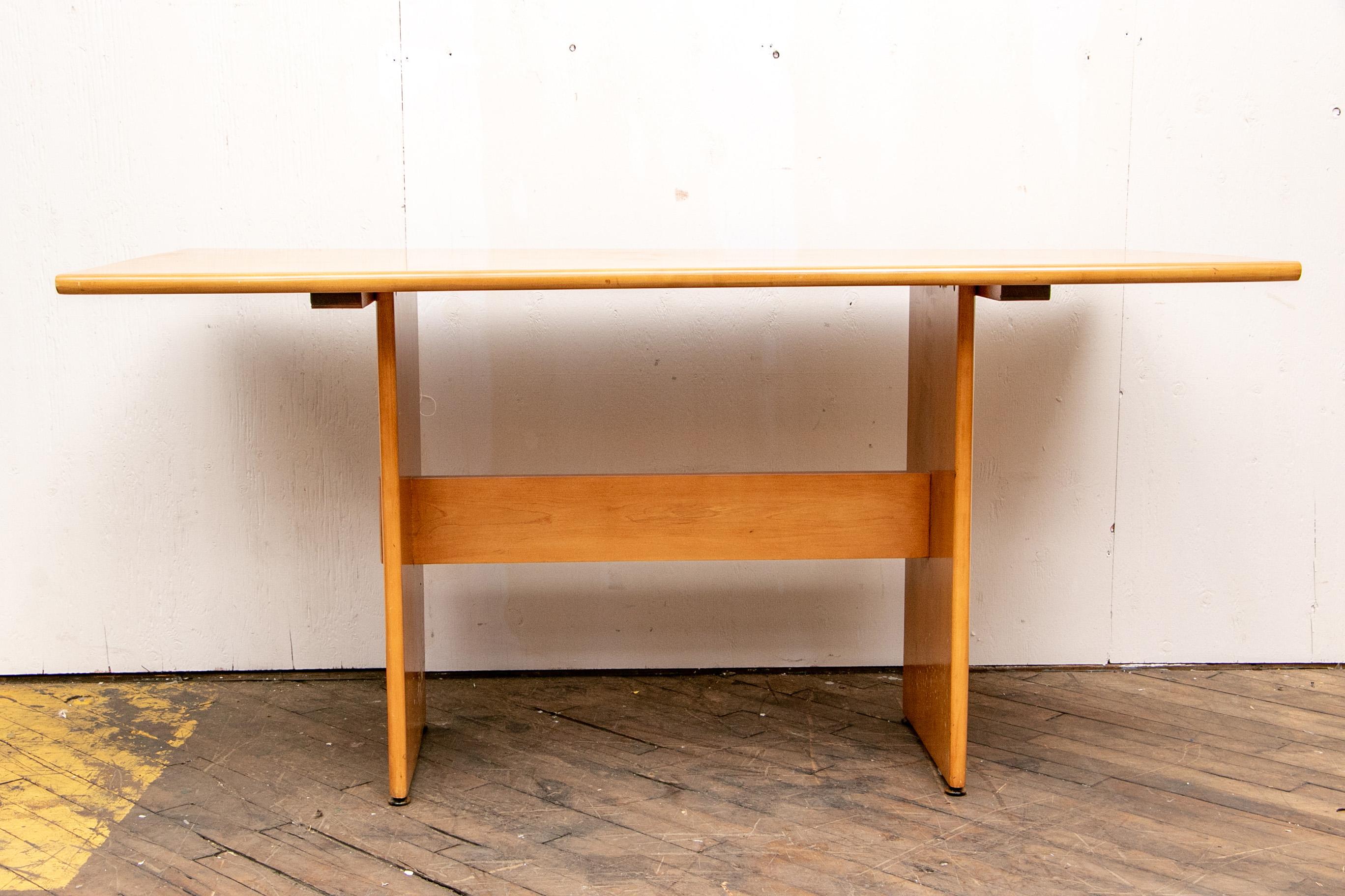 Sticker on the table. Blond maple rectangular table with rounded top ends, a flat stretcher and flat side supports. Along with two matching benches of the same construction.

Condition: Table with some scratches and a spot, benches length 60