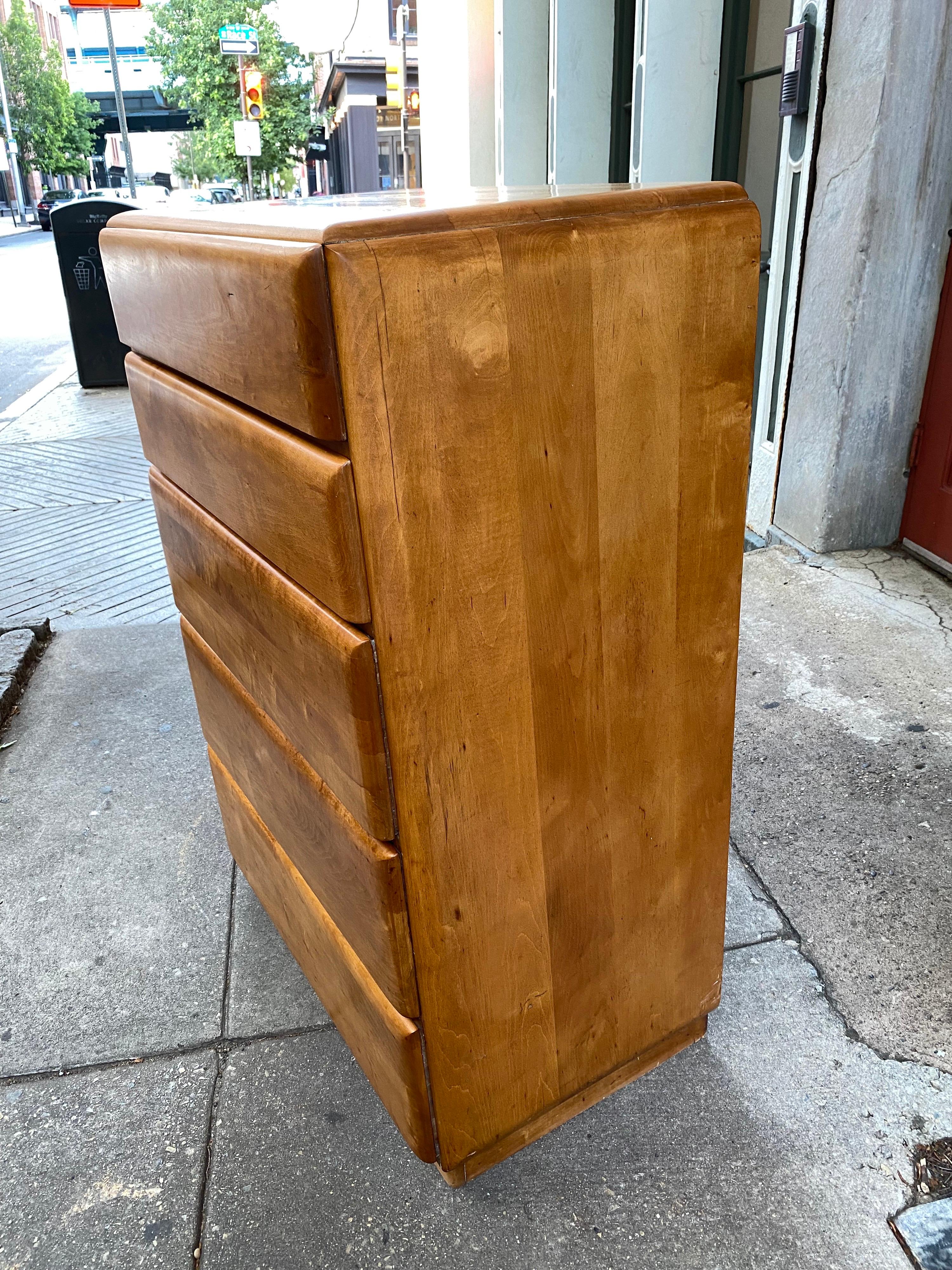 Russel Wright 5 drawer solid maple dresser. Dates to the early 1950’s, was said to be a line he did for Sears. Was refinished 15 years ago, still looks good but shows some flaws as seen in photos. A little white paint to the bottom where your