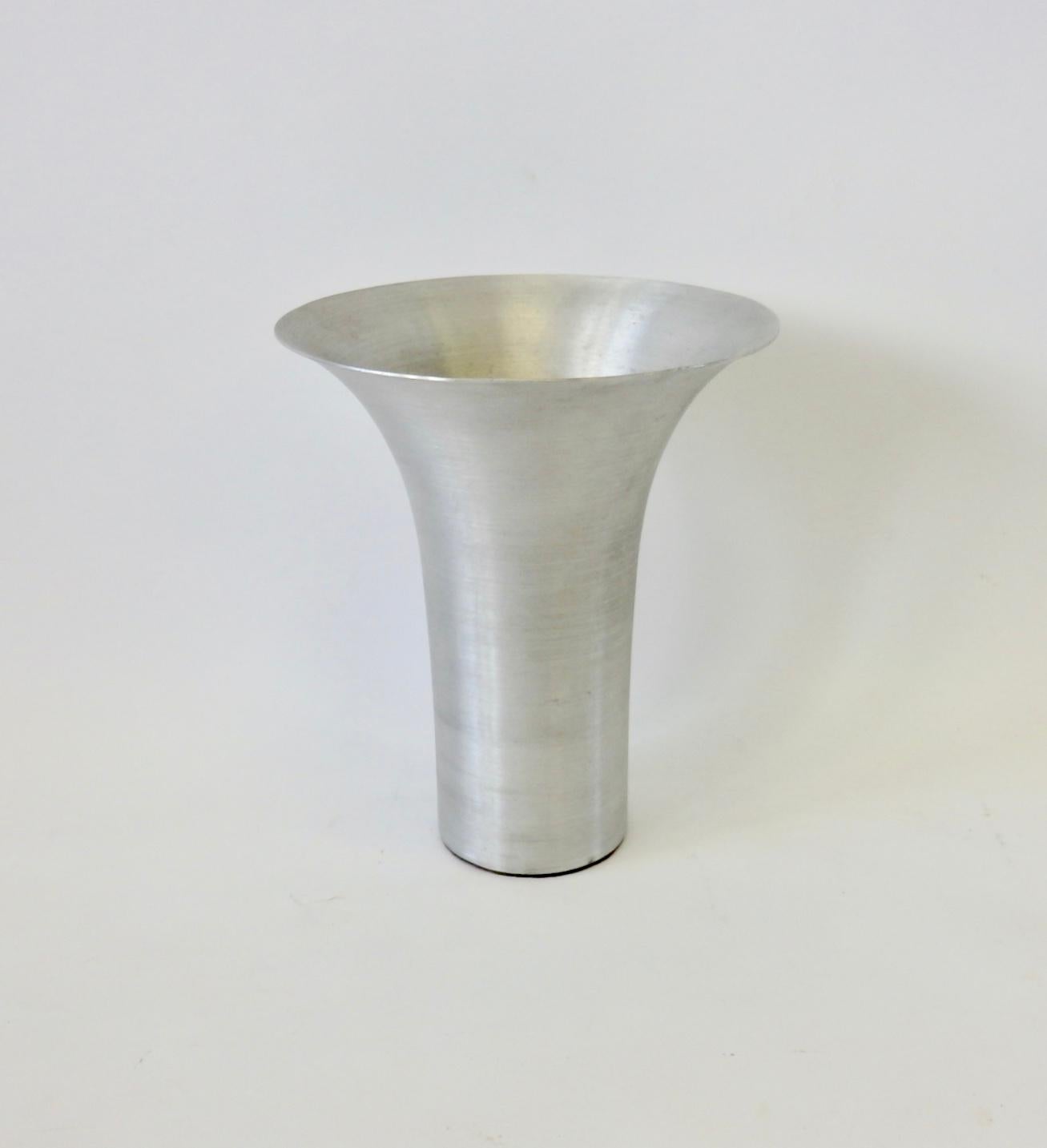 Spun aluminum flare top vase designed by Russel Wright. Stamped Russel Wright on underside.
