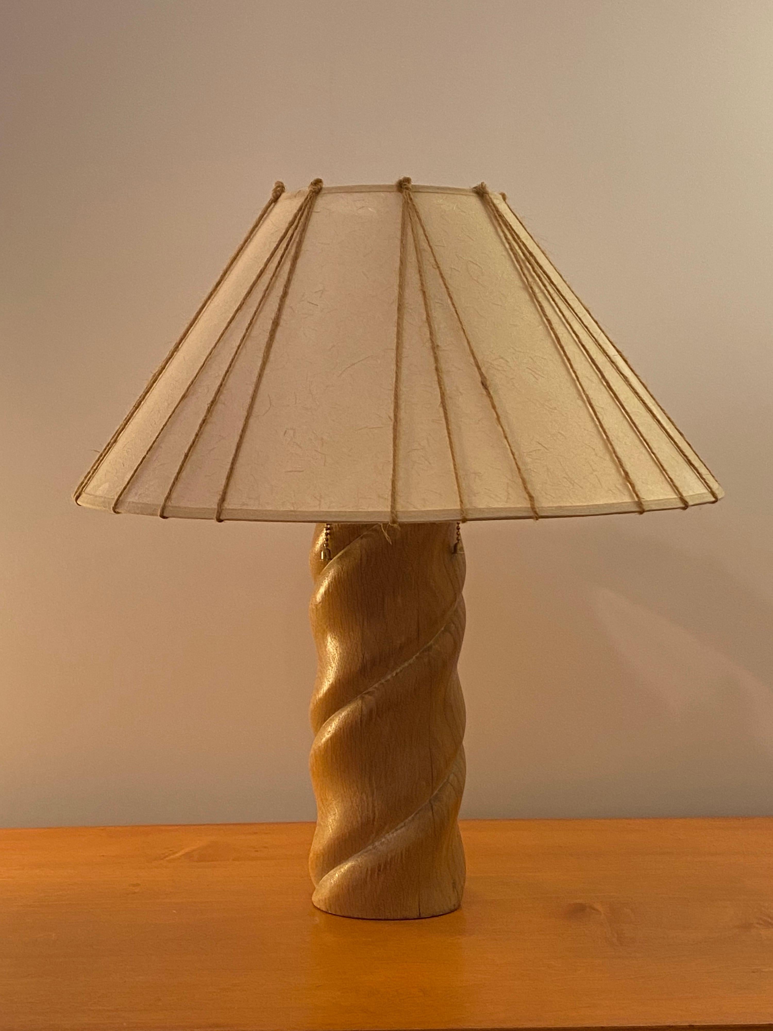 Russel Wright turned wood table lamp with a slightly pickled white finish. Early 1950's lamp produced by Fairmont Lamp Company. Original lampshade was recovered with paper very much like the original, and cord was wrapped around like originally