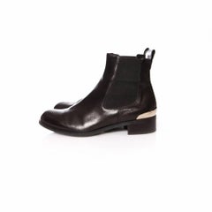 Russell & Bromley, black leather chelsea boots with silver metal on the heels