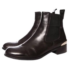 Russell & Bromley, black leather chelsea boots with silver metal on the heels