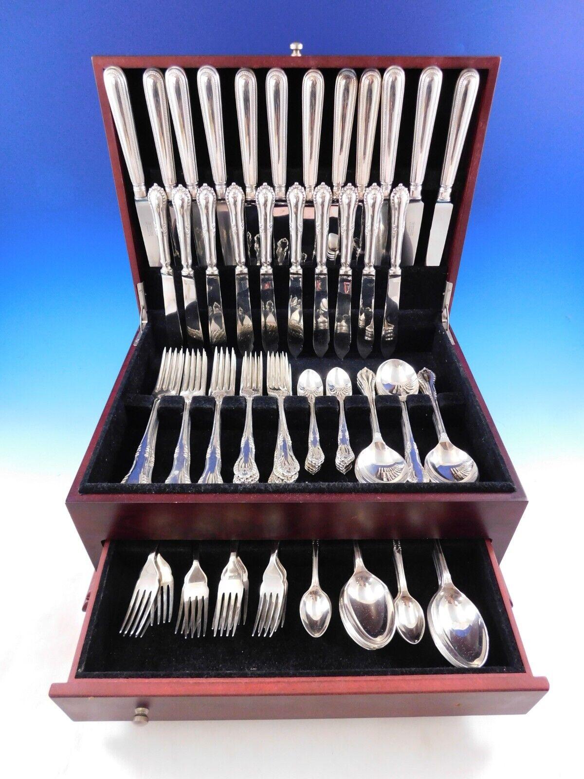 Superb Russell by Garrard, Sheffield 1976 sterling silver Flatware set, 104 pieces. This set includes:

12 Extra Large Dinner Size Knives, 10 1/4