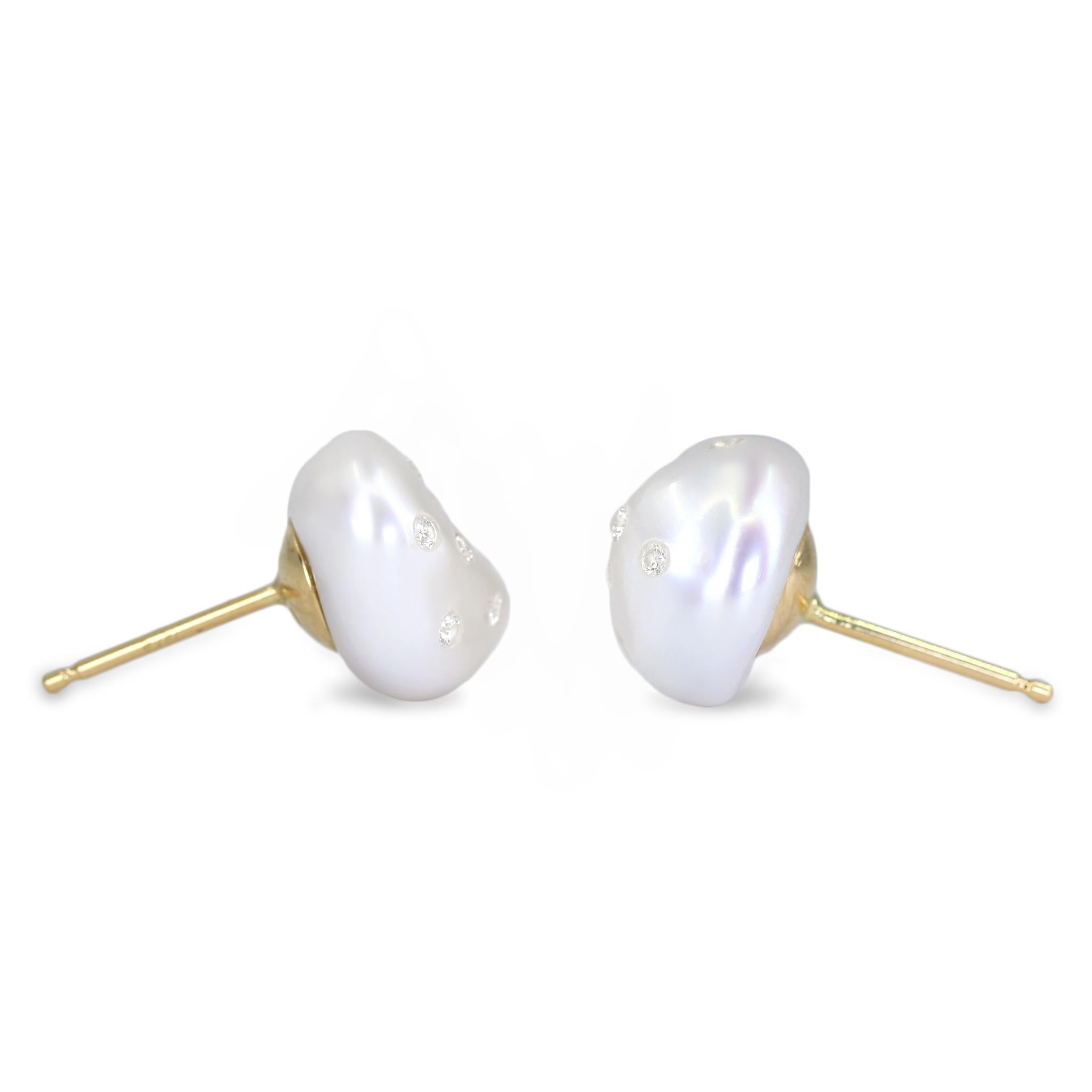 One-of-a-Kind Baroque Keshi Pearl Stud Earrings with 0.32 total carats of embedded round brilliant-cut white diamonds and with 18k yellow gold cupped posts and jumbo 14k yellow backs. Stamped 18k / 14k. 

About the Maker - Russell Trusso was a