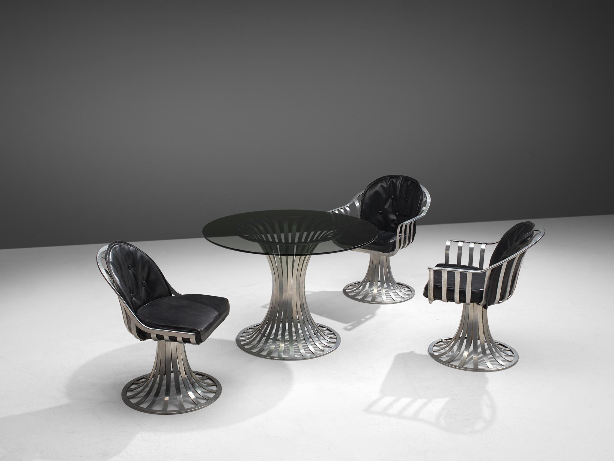Russell Woodard, dining set, leatherette, glass and aluminum, United States, 1960s.

This stylized dining set, consisting of a table, two armchairs and one dining chair was designed by Russell Woodard and produced by the Lee L. Woodard and Sons