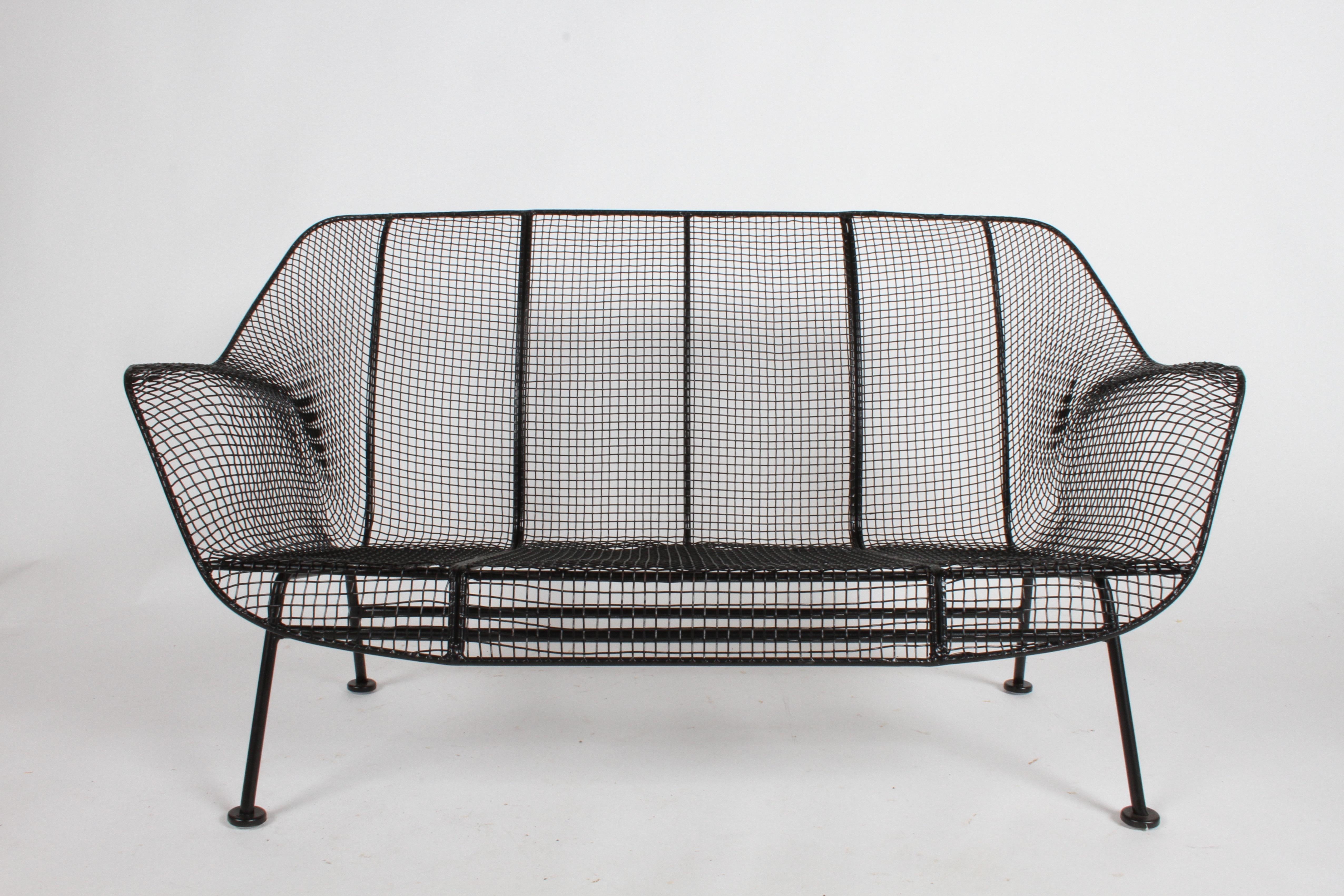Mid-Century Modern Russell Woodard designed Sculptura wrought iron mesh settee. This settee to be restored, includes sandblasting, dipped in rust coating and sprayed with satin black. New plastic glides to be added to feet. Measures: Seat height is