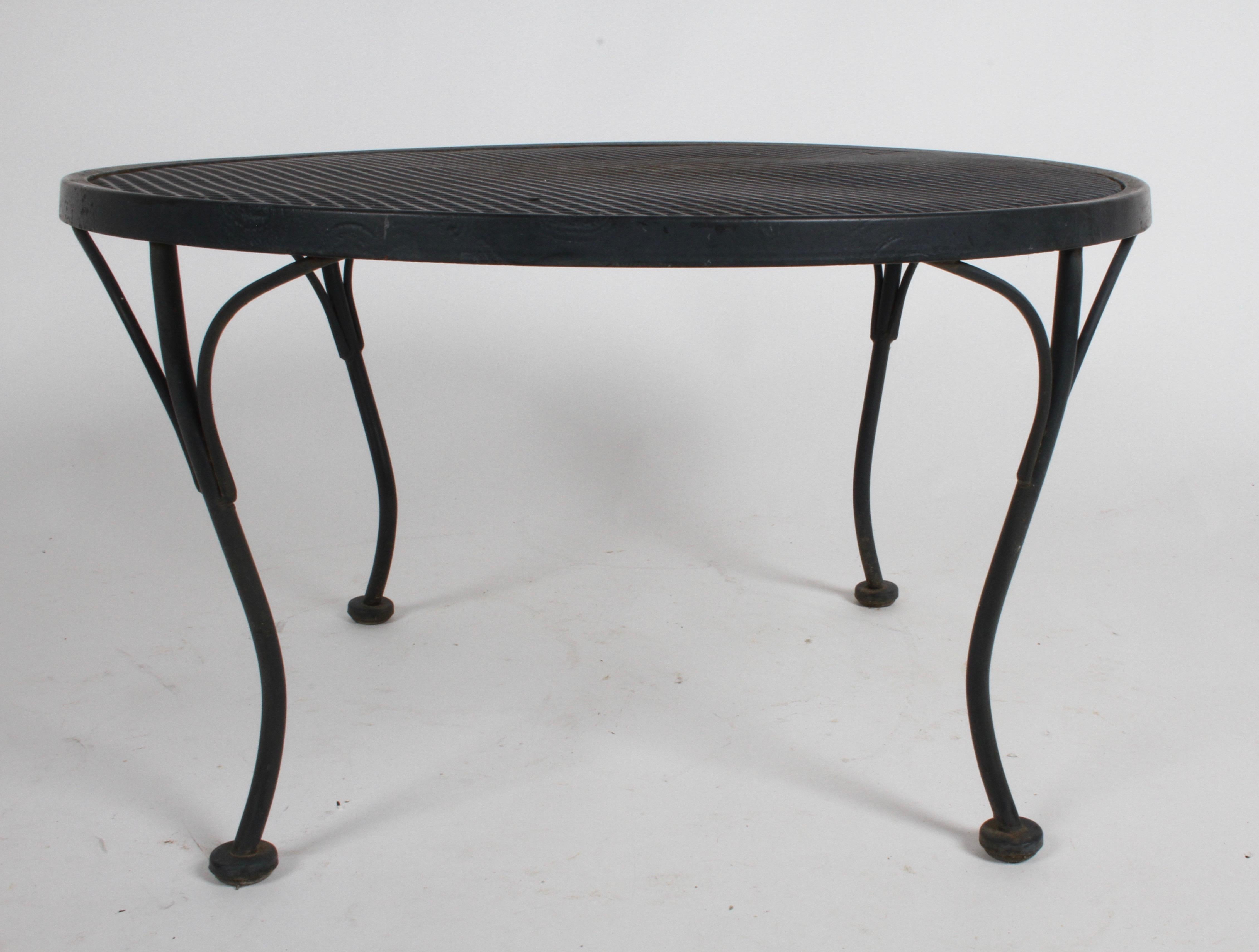 Russell Woodard designed round coffee or side often see along side his Sculptura line chairs and settees. Shown in original black paint, from one owner estate, circa 1950s. Two available. Overall very nice condition, lite rust. Can be refinished if