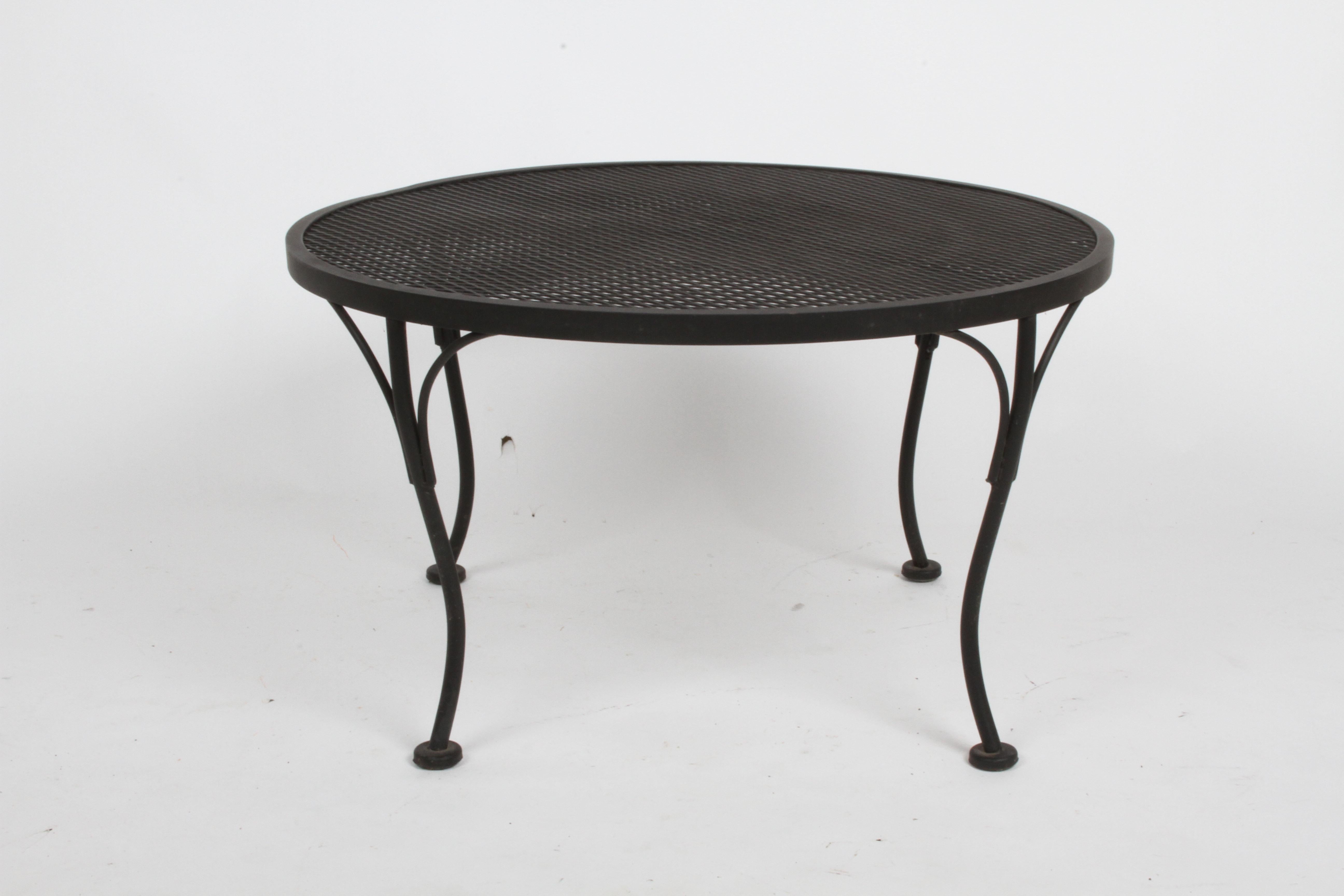 Russell Woodard designed round coffee or side often see along side his Sculptura line chairs and settees. Shown in original matte black paint is sold, is now sold . I have one in green paint , price Includes, blasting, rust inhibitor and new paint