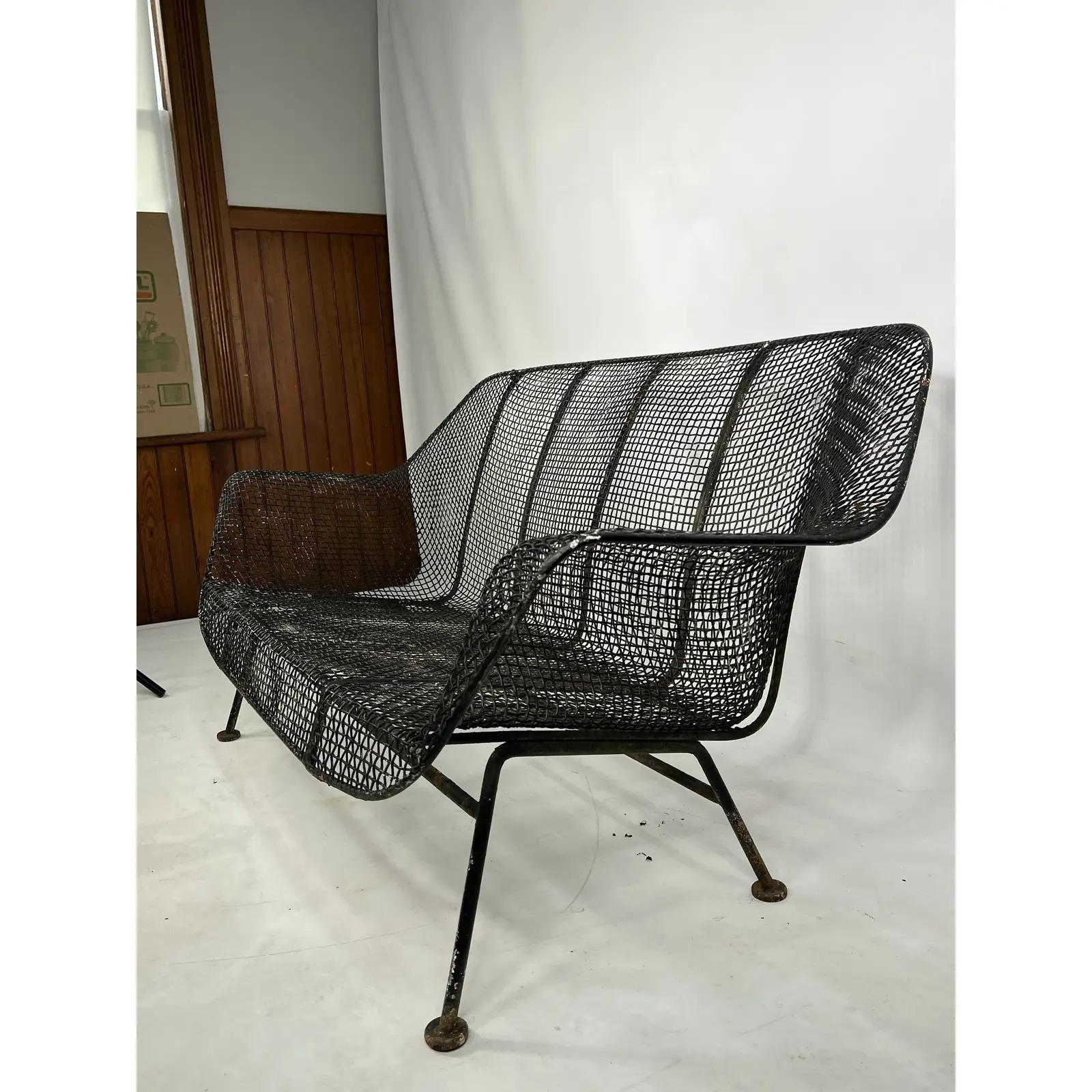 This Russell Woodard Patio Loveseat is made out of wrought iron with steel and mesh. This would make an amazing centerpiece for any outdoor area.