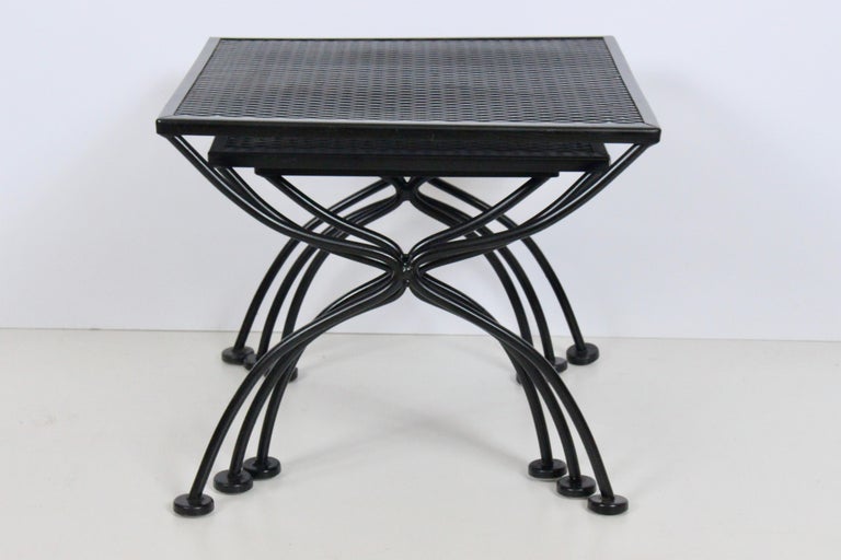 American Mid Century Modern set of 3 Russell Lee Woodward Stacking Tables.  Featuring original Indoor / Outdoor square black enameled wrought iron and expanded wire design. Sturdy. Balanced. Classic. Newly refinished. Top Table: 16.5H x 19 x 19. Mid