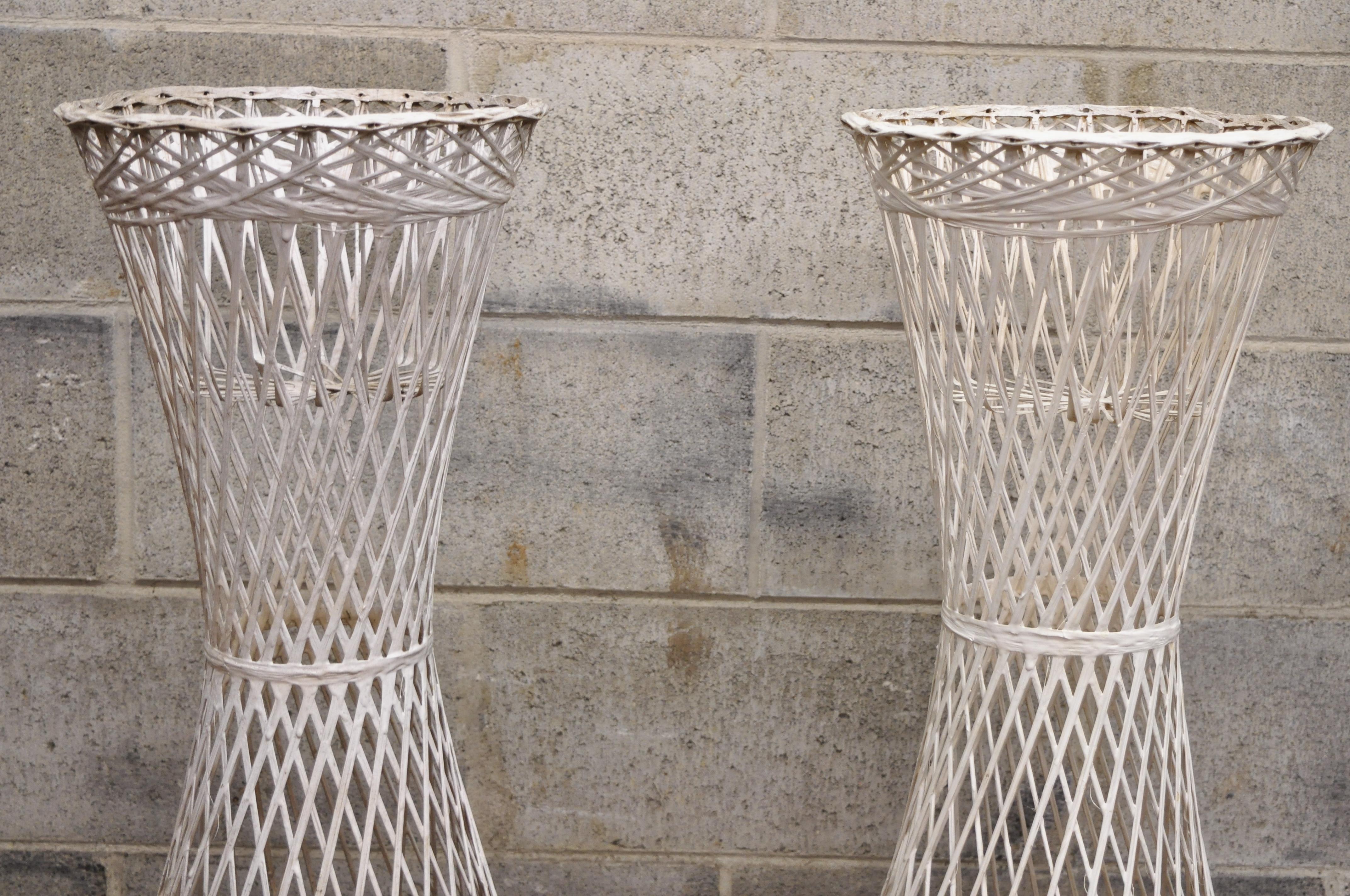 Russell Woodard woven spun fiberglass Mid-Century Modern plant pedestal stands - a pair. Item features woven spun fiberglass, clean modernist lines, quality American craftsmanship, great style and form, circa mid 20th century. Measurements: 30.5
