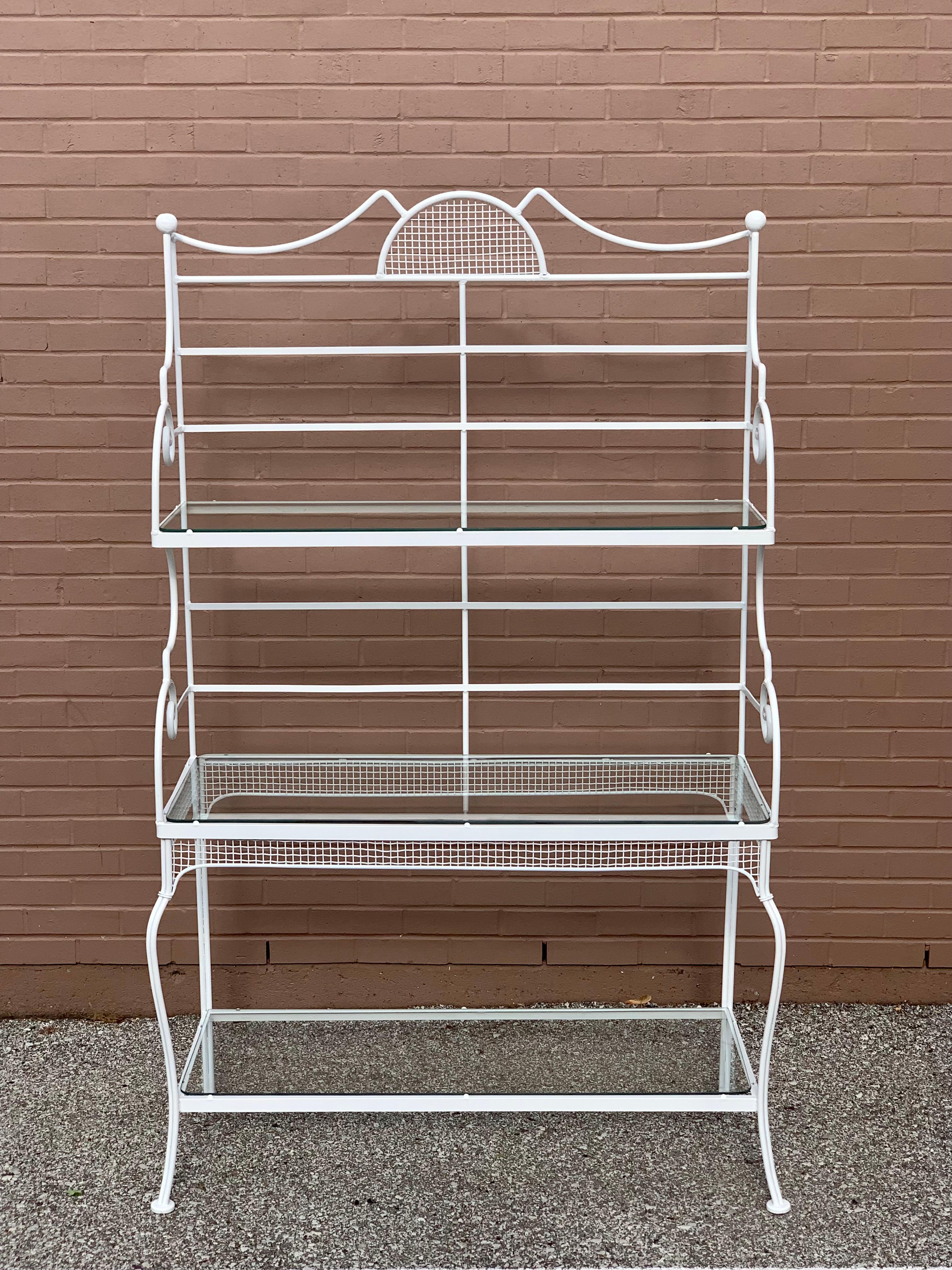 Russell Woodard for Woodard Furniture Company, 1950s MCM Sculptura line 3 - tiered bakers rack with three glass shelves and scroll design. The wrought iron and mesh frame has recently been sandblasted, applied rust inhibitor and painted in a satin