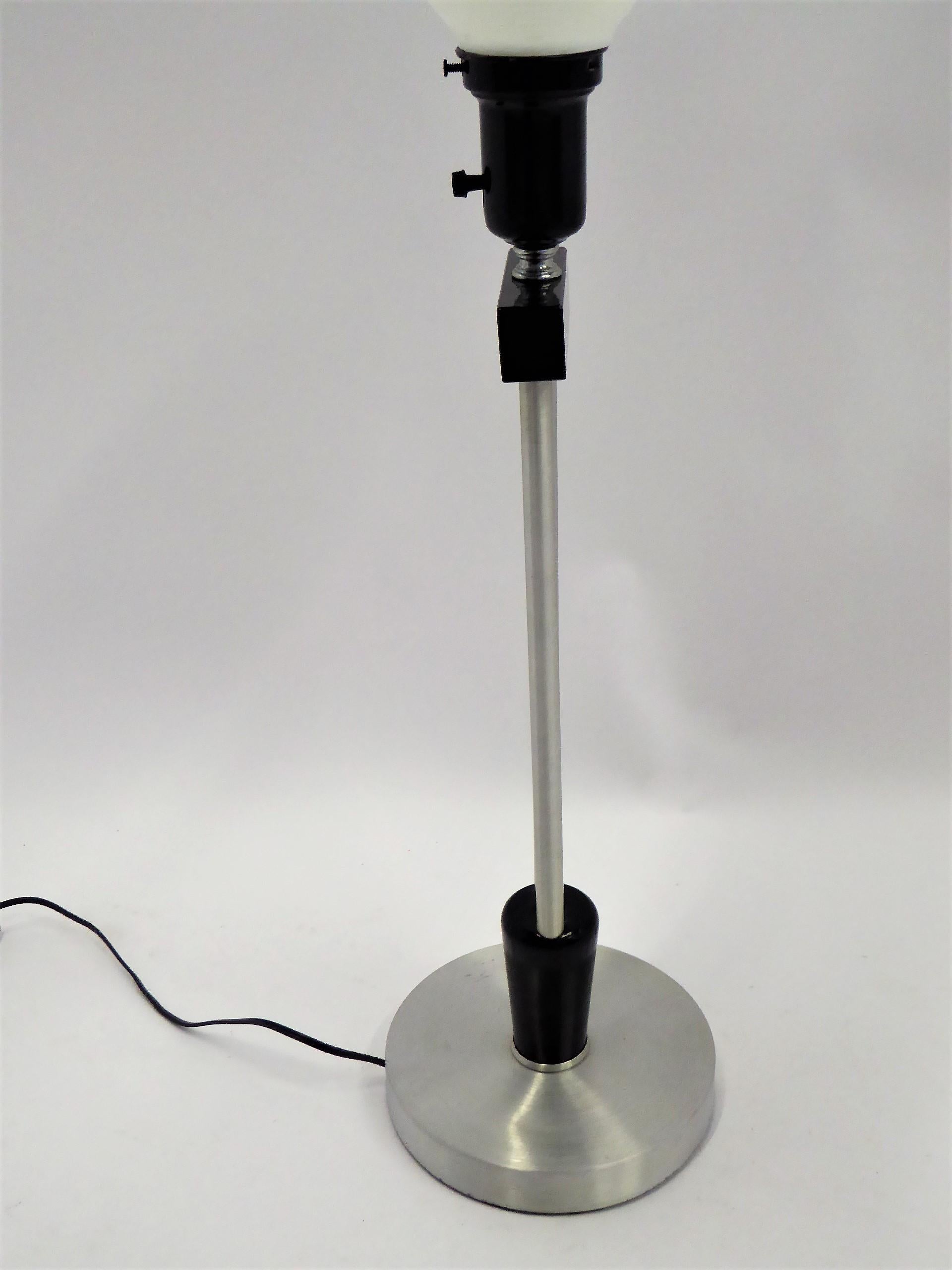 Mid-20th Century  Russell Wright Spun Aluminum and Black Wood Table Lamp with Milk Glass Globe