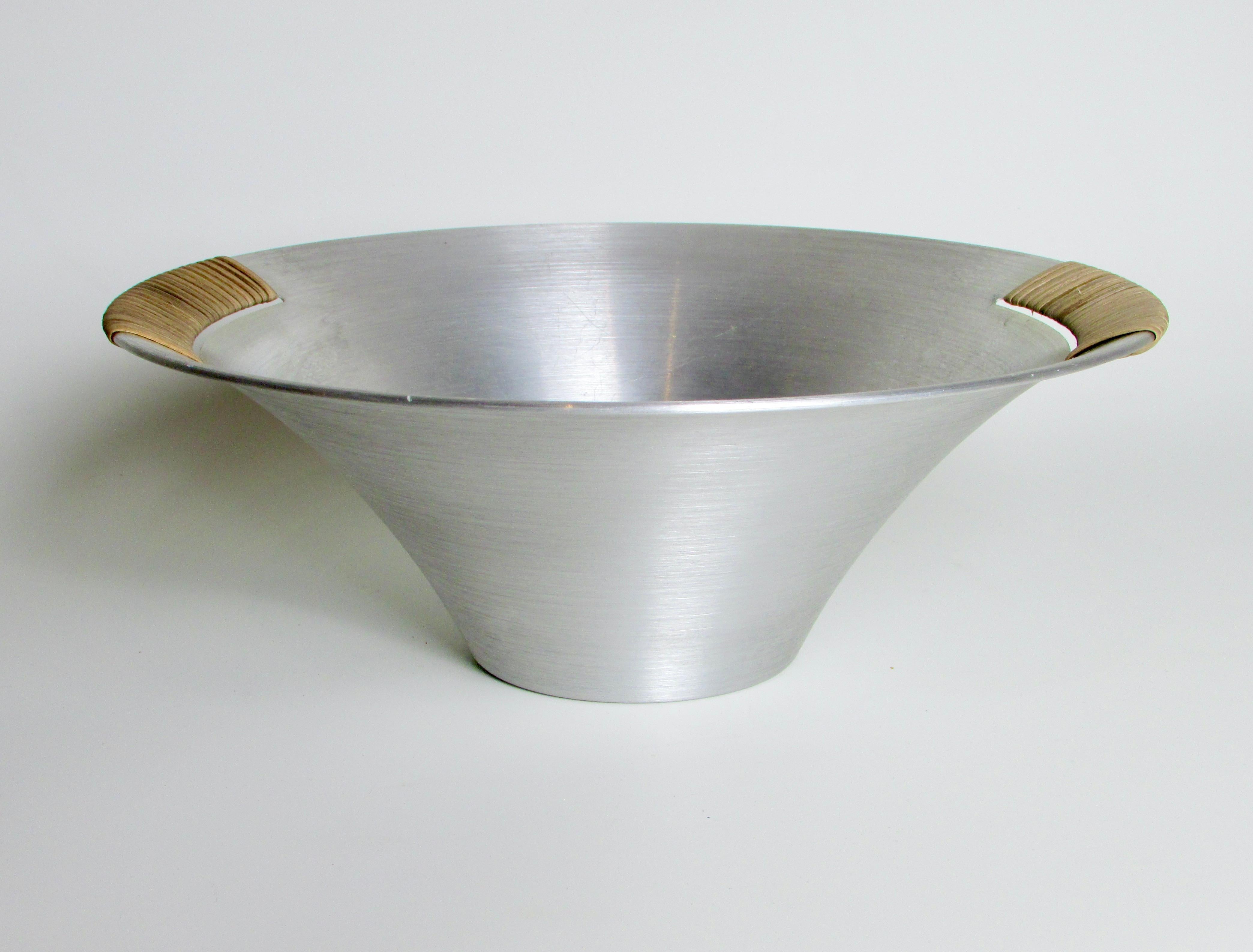 Russell Wright spun aluminum bowl with raffia wrap .  2