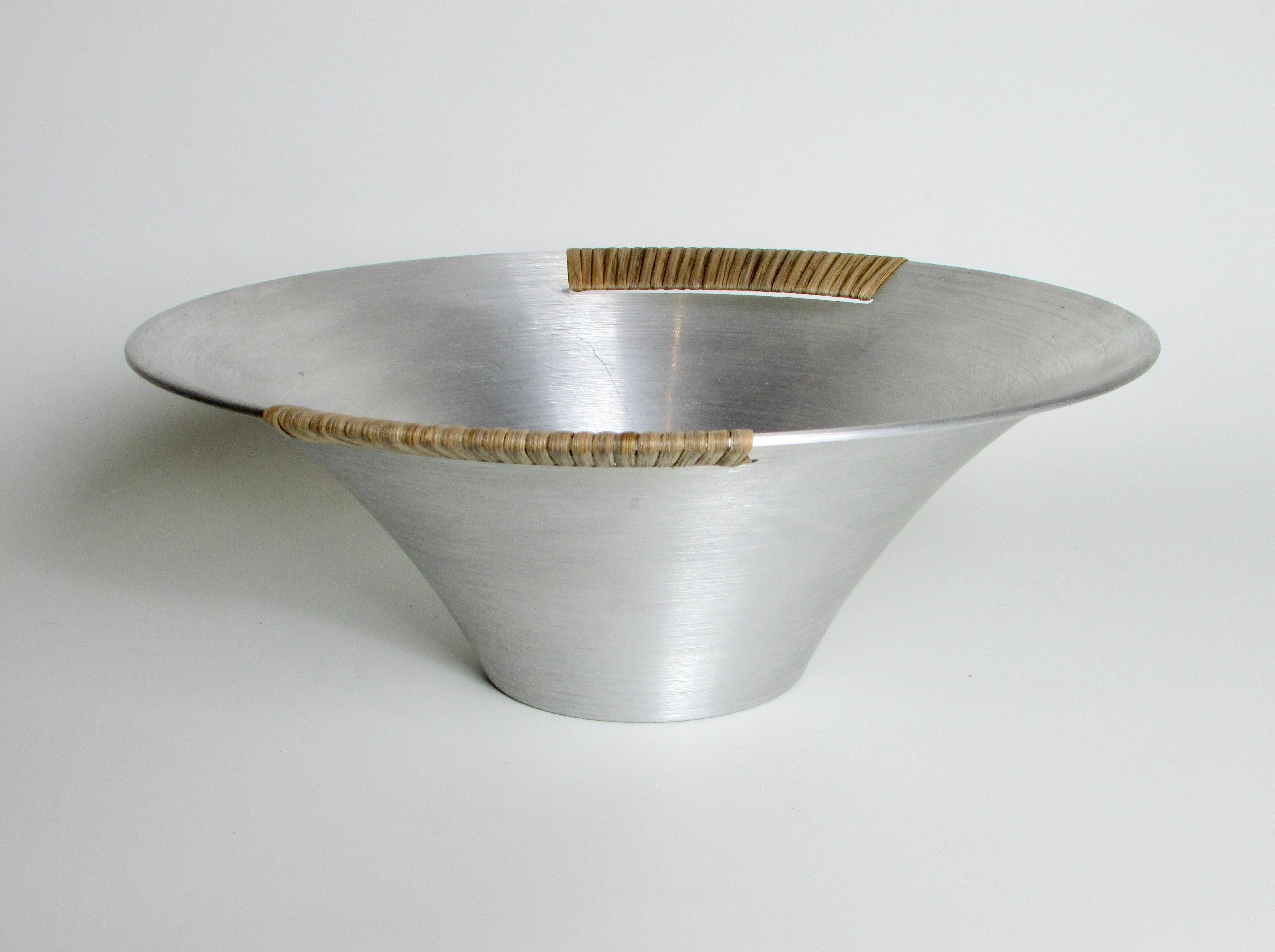 Russell Wright spun aluminum bowl with raffia wrap .  3