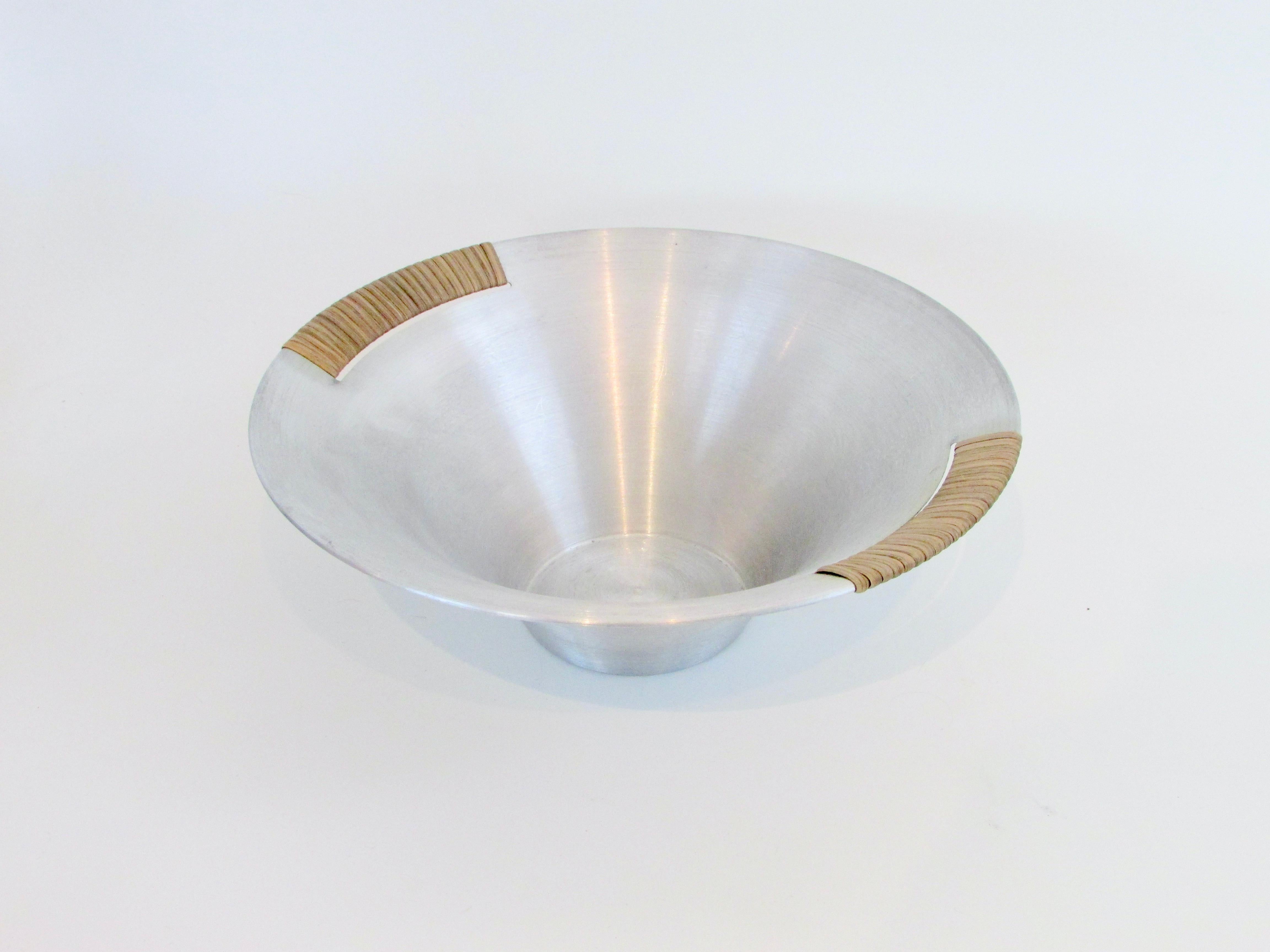 American Russell Wright spun aluminum bowl with raffia wrap . 