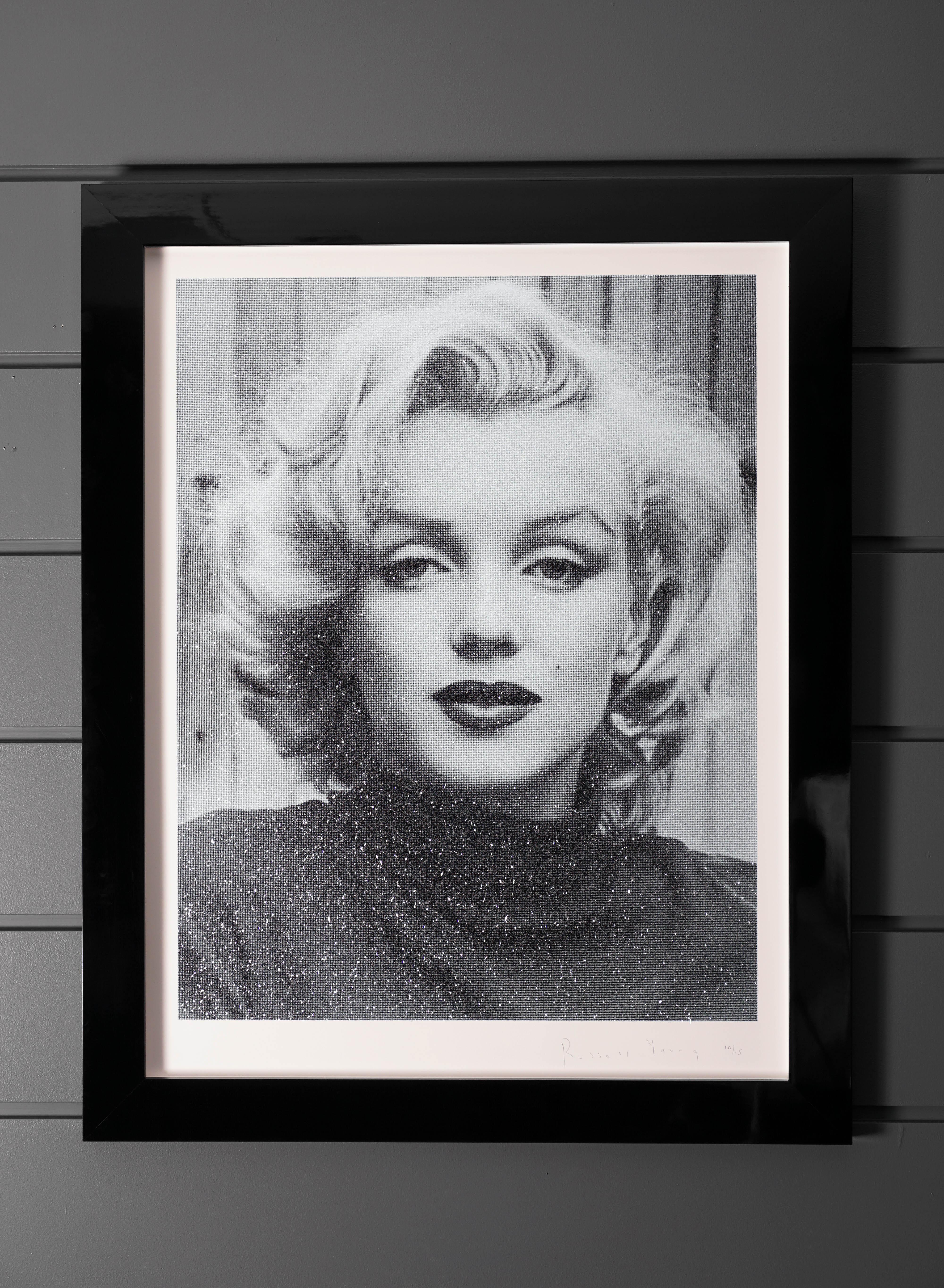 Marilyn with Diamond Dust (2019) by Russell Young has a superstar finish in powder blue. Shimmering in the light with thousands of Diamond Dust flakes, this artwork shines with incredible depth and glow. This newly released series is absolutely