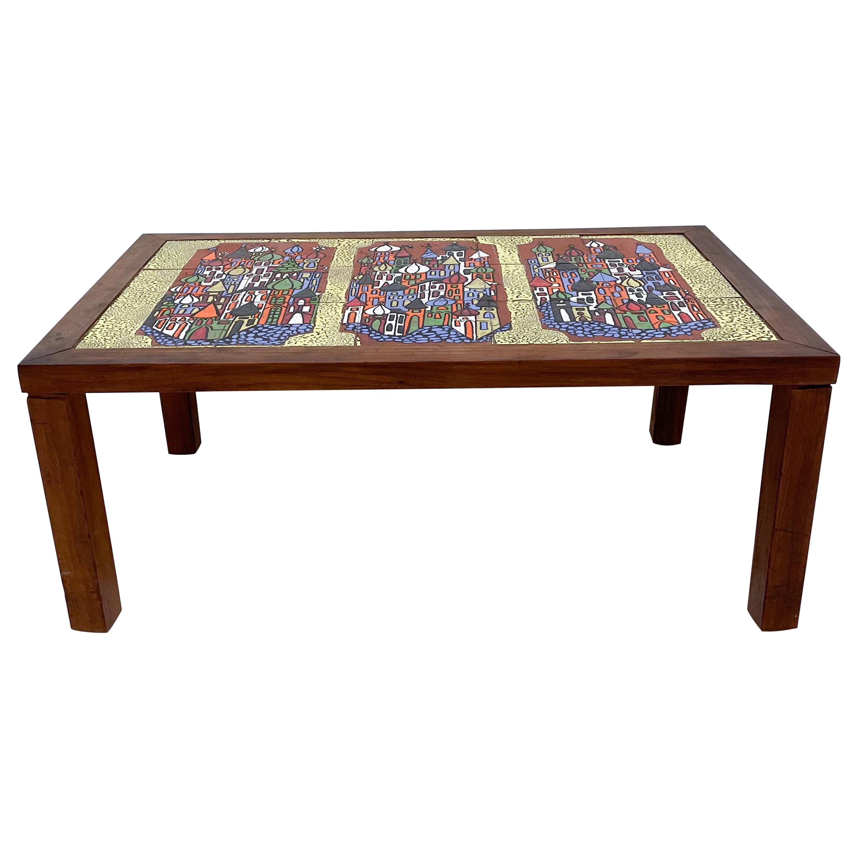 AMBIANIC presents
Decorative Wood Coffee Table with Colorful Ceramic Tiles Russian Illustrations 
Coffee Table in the manner of Roger Capron 1970s Tiled designs
No maker label present. 
Measures: 33.25W x 21.5