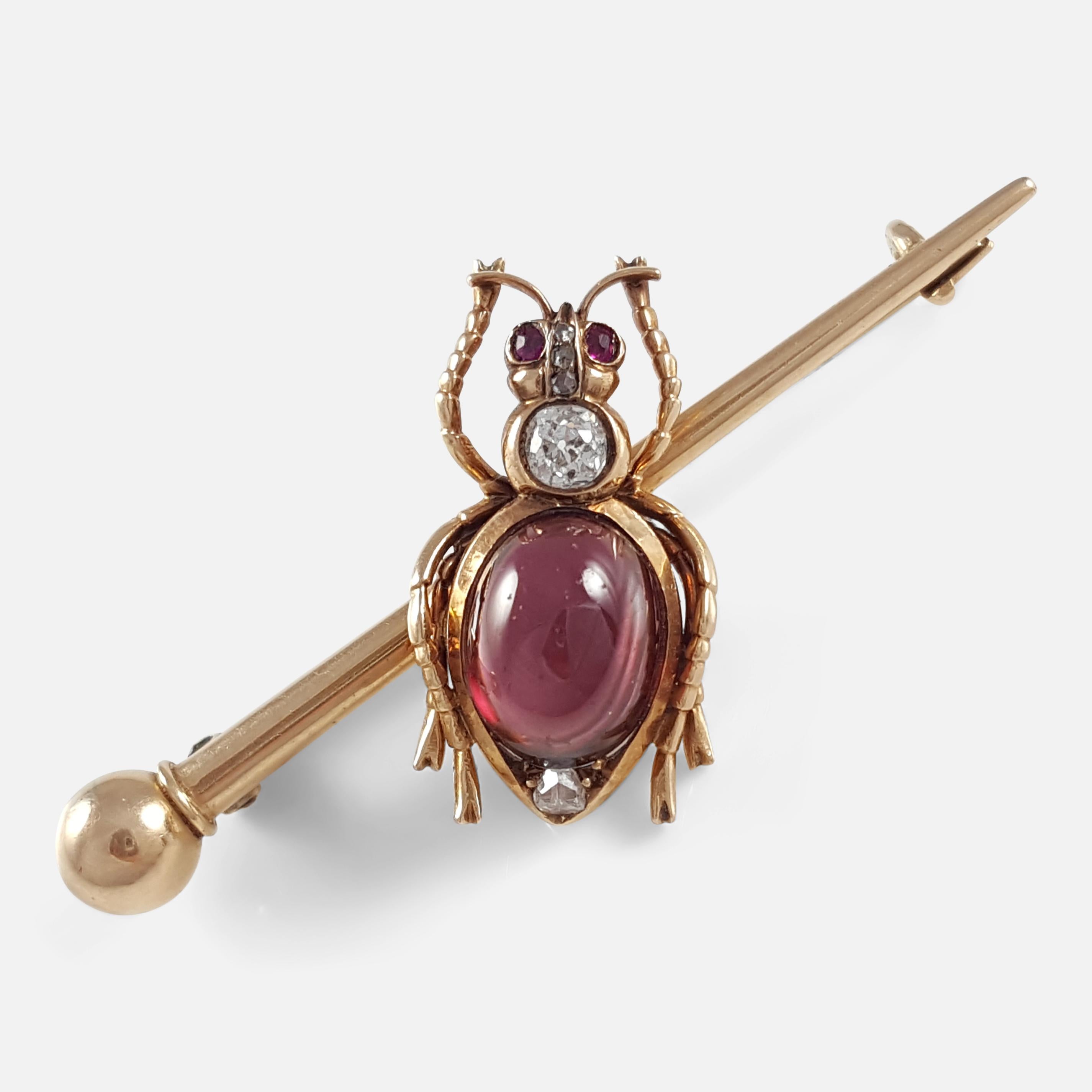A beautiful Russian 14k yellow gold 0.20cts diamond, and garnet cabochon insect brooch - circa 1895. The brooch is crafted in 14k gold, with garnet cabochons, and diamonds set to the body, and head. The brooch is stamped to the C clasp with the