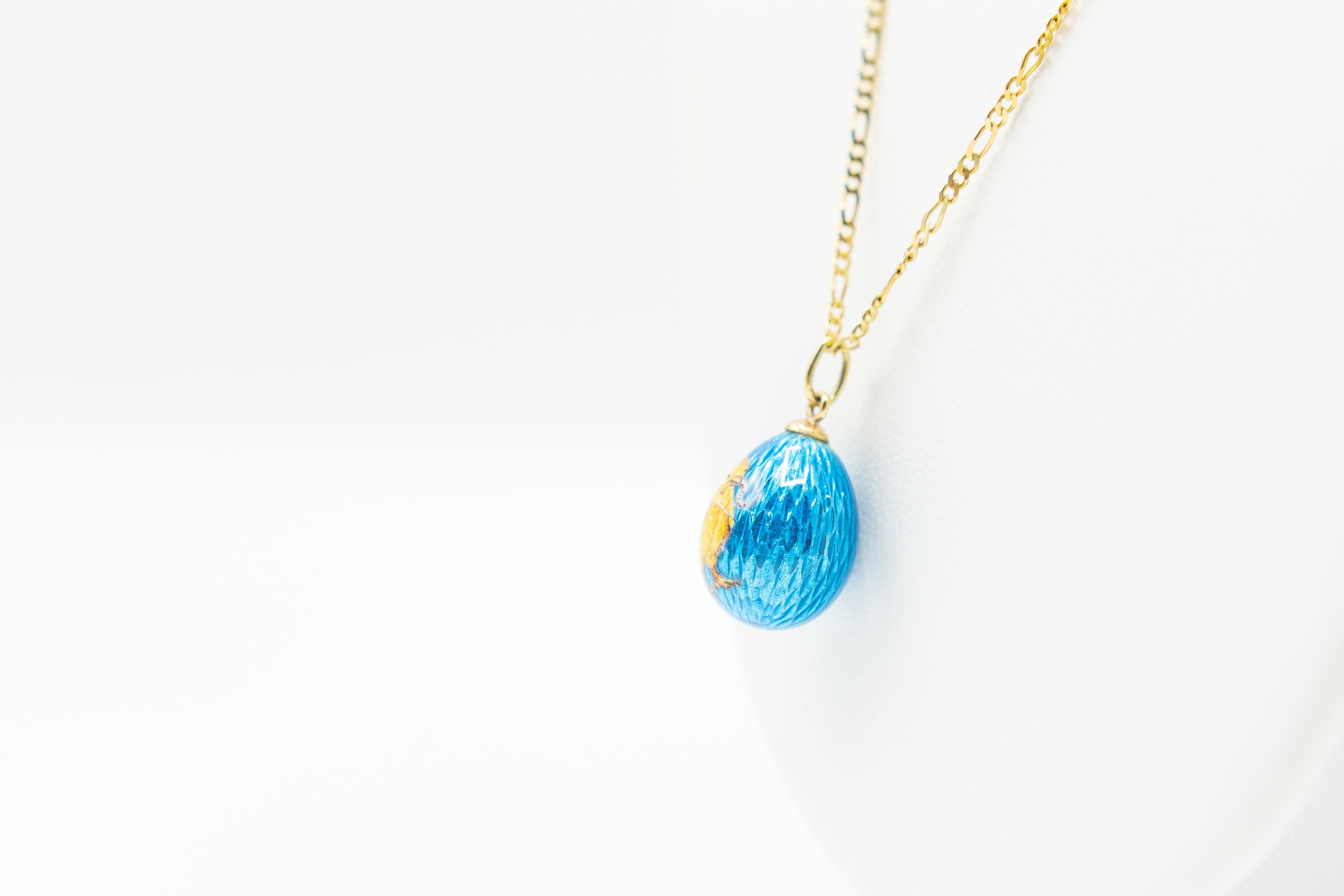 Russian 14k Gold Guilloche Enamel Egg Chick Vintage Charm Pendent, Iridescent Guilloche Enamel Egg in 14k gold

The enamel is a lovely turquoise blue that has wonderful sheen. The front is decorated with an adorable yellow chick, a symbol synonymous