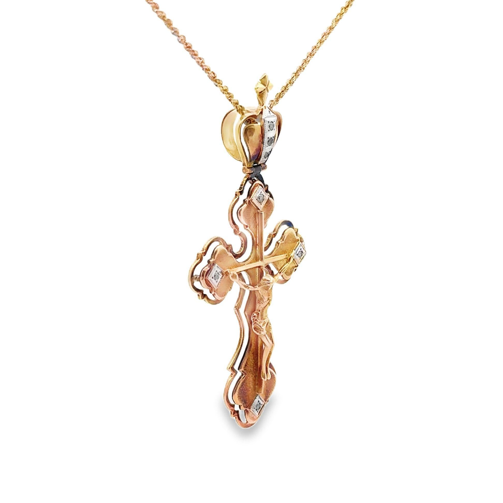 A beautiful mid-century piece made in Russia in the 1950’s. It features a stoic Jesus on the cross and is adorned with 7 round-cut diamonds. Made in 14k yellow gold, has Russian hallmarks, and comes with a lovely rope necklace ready to be