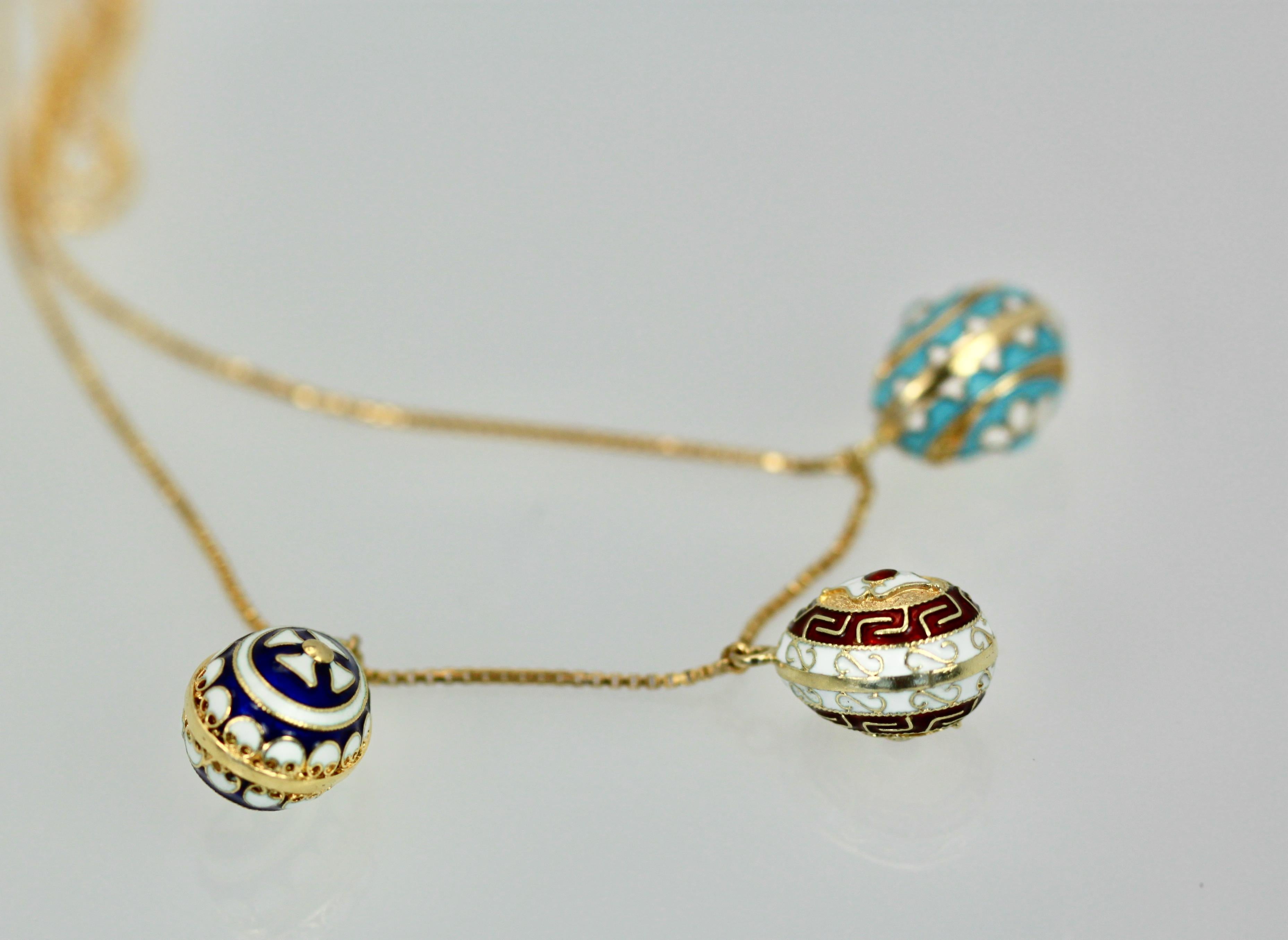 yellow 14k gold necklace with sapphire blue enameled egg