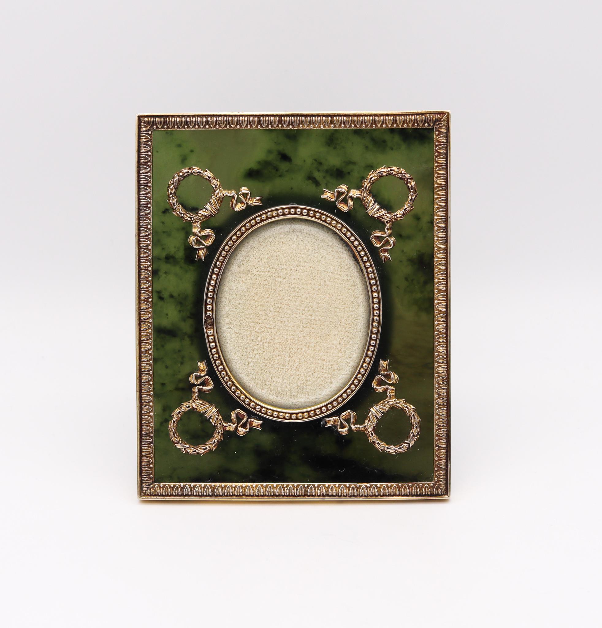 Nephrite jade and gilded silver desk frame.

Beautiful neo classic desk picture frame, created in Moscow Russia, back in the 1915. Carefully crafted in the Russian imperial and Louis XVI style, with solid gilded silver, translucent nephrite green