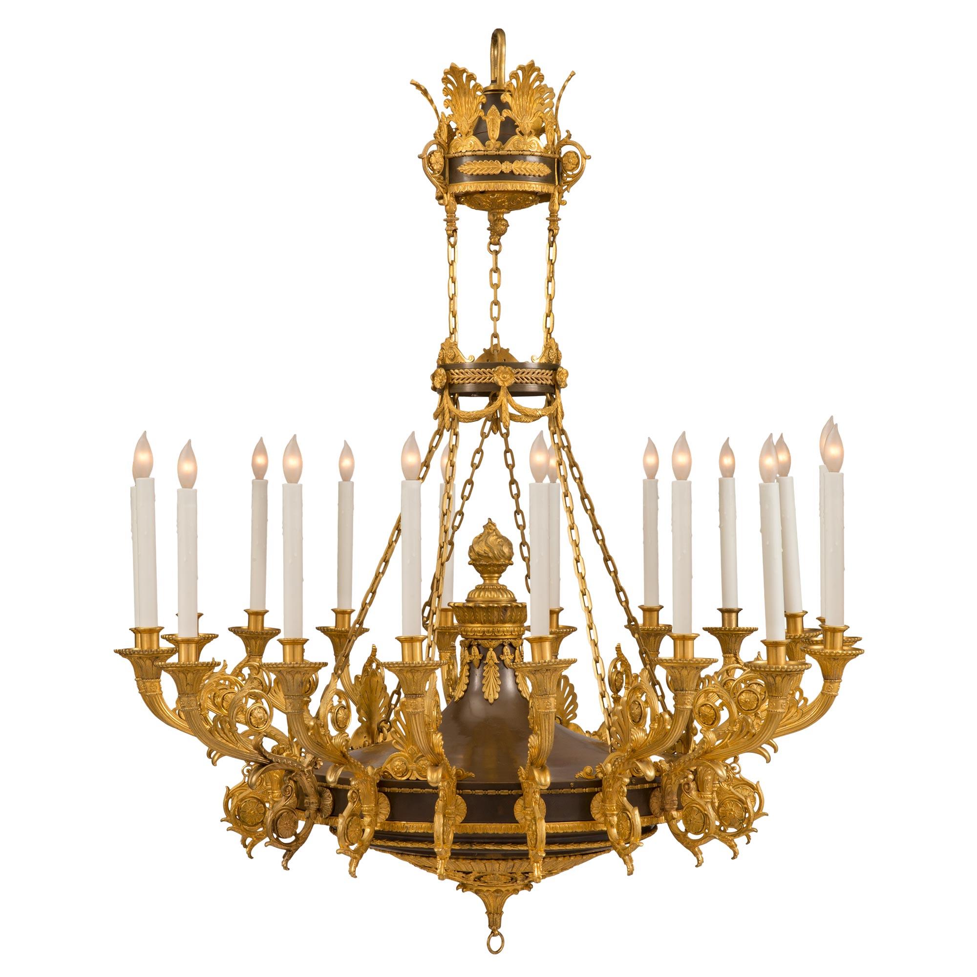 A sensational and most impressive Russian 19th century Empire st. patinated bronze and ormolu eighteen light chandelier. The chandelier is centered by a fine inverted bottom finial with elegant acanthus leaves and beautiful pierced ormolu palmettes.