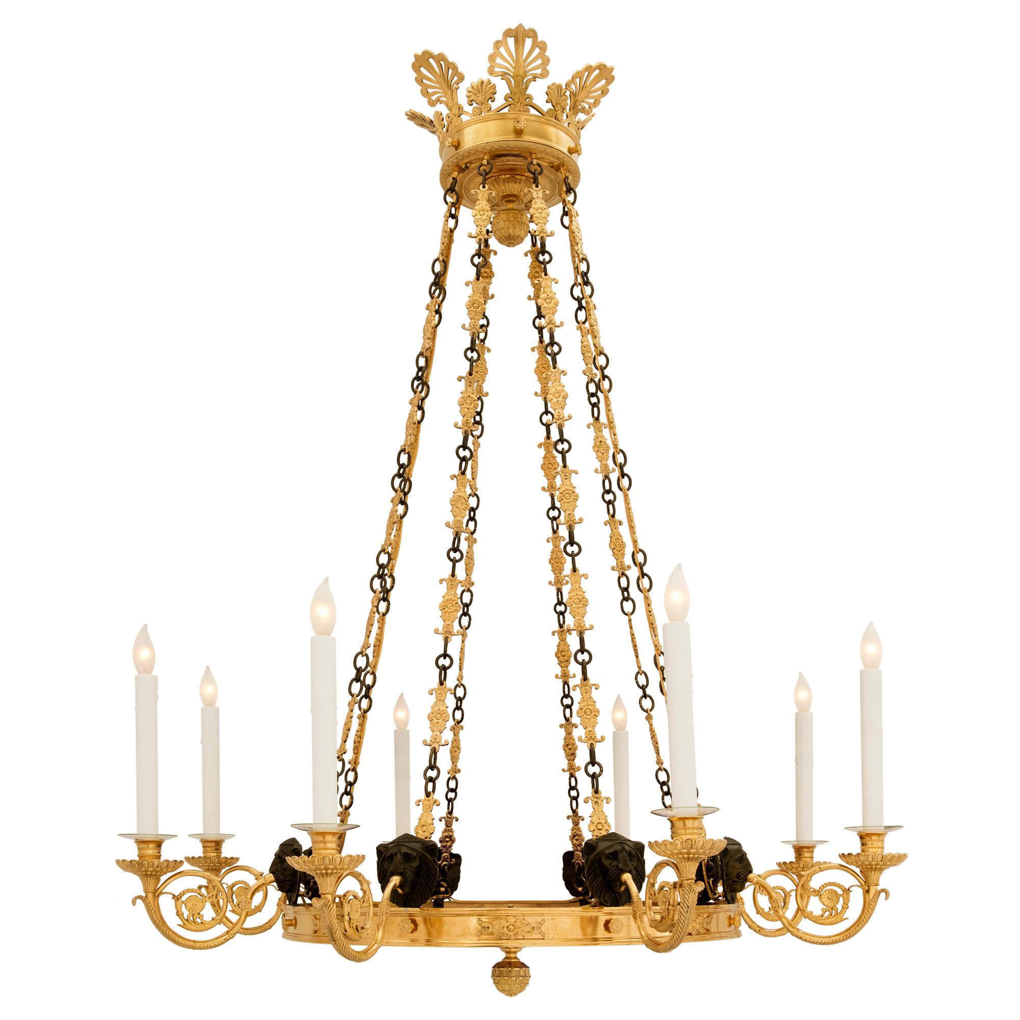 A stunning and extremely decorative Russian early 19th century Neo-Classical st. patinated bronze, ormolu and cobalt blue glass eight arm chandelier. The chandelier displays a most impressive bottom ormolu foliate finial centering the beautiful