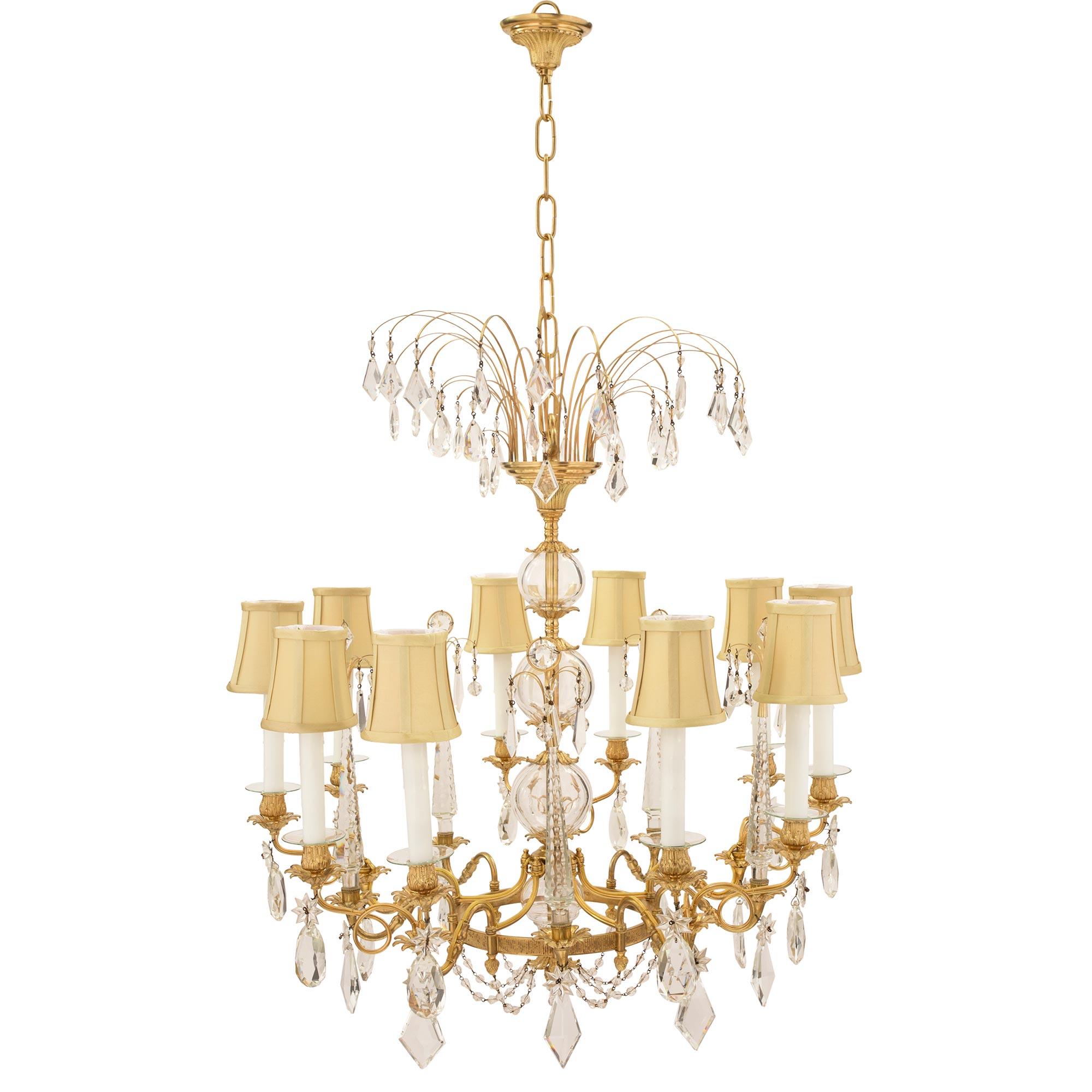 A stunning Russian 19th century Neo-Classical st. ormolu and crystal chandelier, in the manner of Johan Zekh, one of Saint-Petersburg’s most celebrated masters. This ten light chandelier has a remarkable crystal encased central fut, accented with