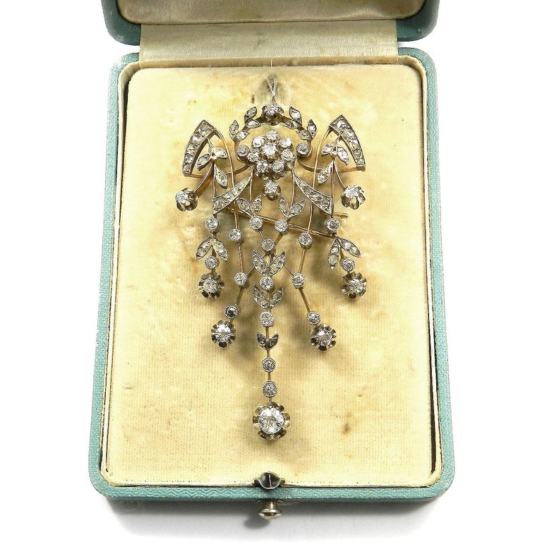 Russian 2.5 carat diamond Gold Pendant Brooch “Devant de Corsage” Moscow circa 1910

This decorative, openwork brooch can als o be worn as a pendant,  featuirng a central rosette, garland, leaf and ribbon motifs is completely set with 67 old