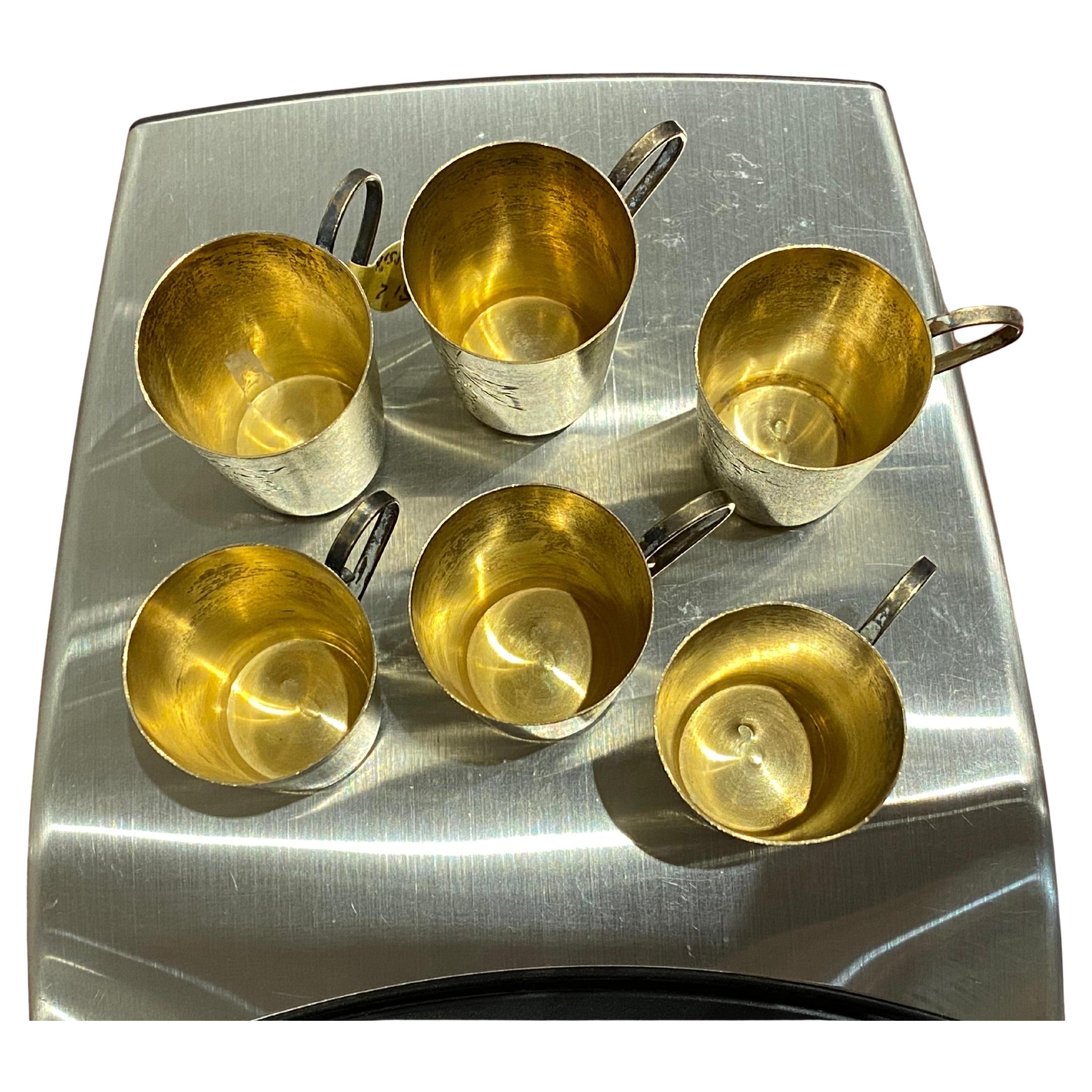 Russian Hallmarked 875 Silver Gilt Set, 
comprising of finely decorated in floral motif coffee cup 
(35mm high) & saucer (with diameter of 11cm), 
bearing Russian hallmarks, stamp & maker’s mark to the base 

6 beaker cups / liquor cups, 
45mm high,